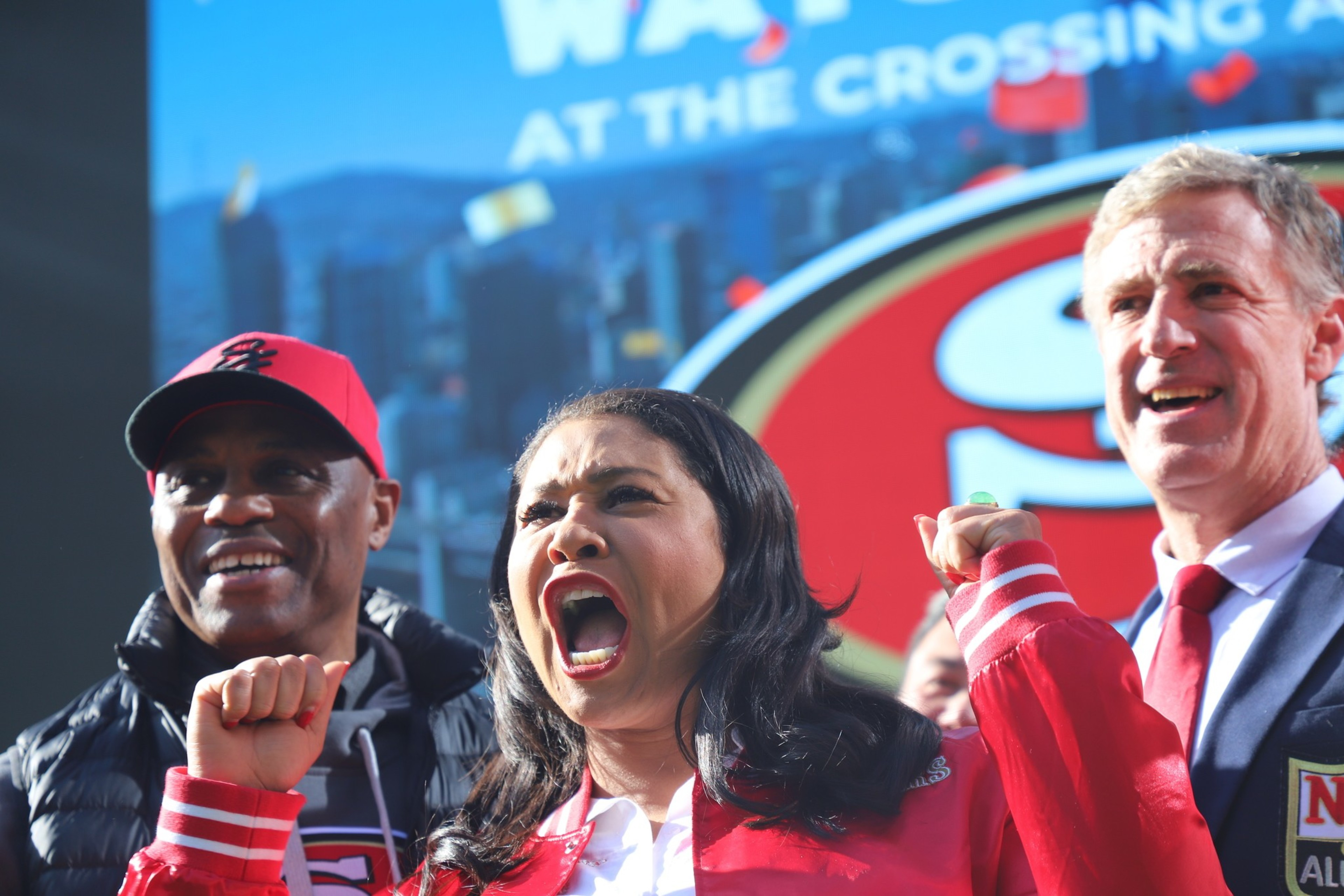 Mayor London Breed stands with former San Francisco 49ers players John Paye, right, and Darryl Pollard at The Crossing at East Cut on Friday, Feb. 9, 2024.
