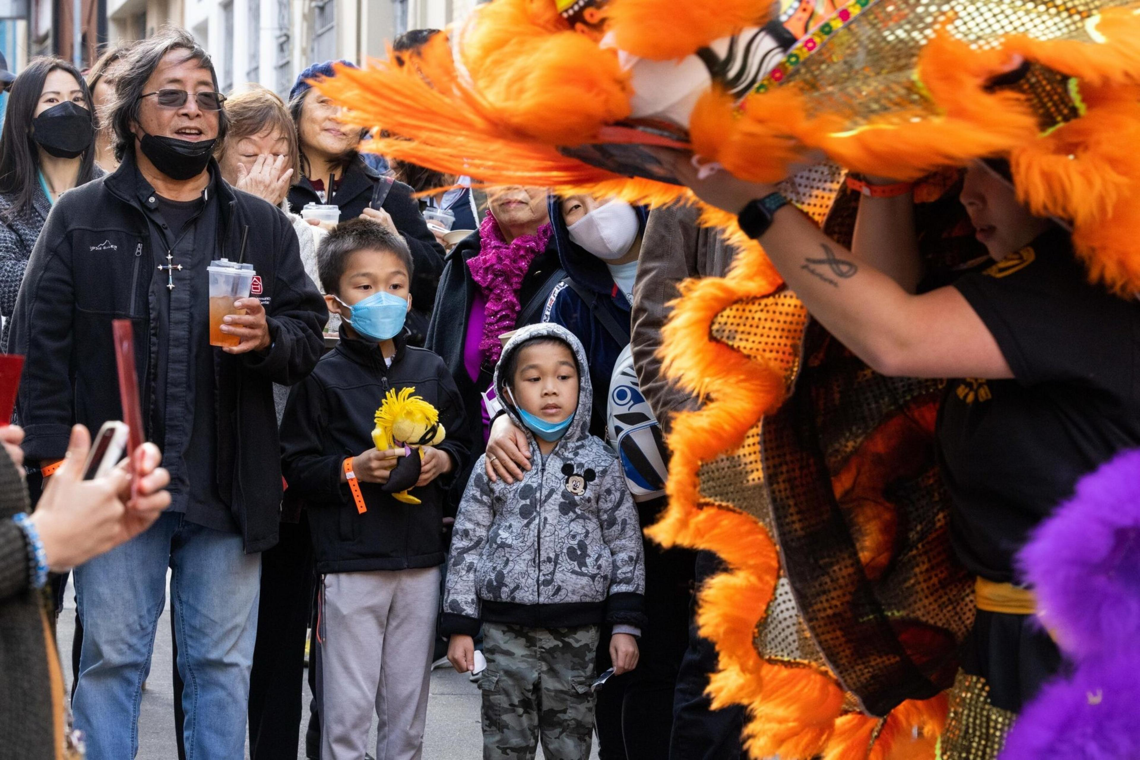 Children and adults watching performance