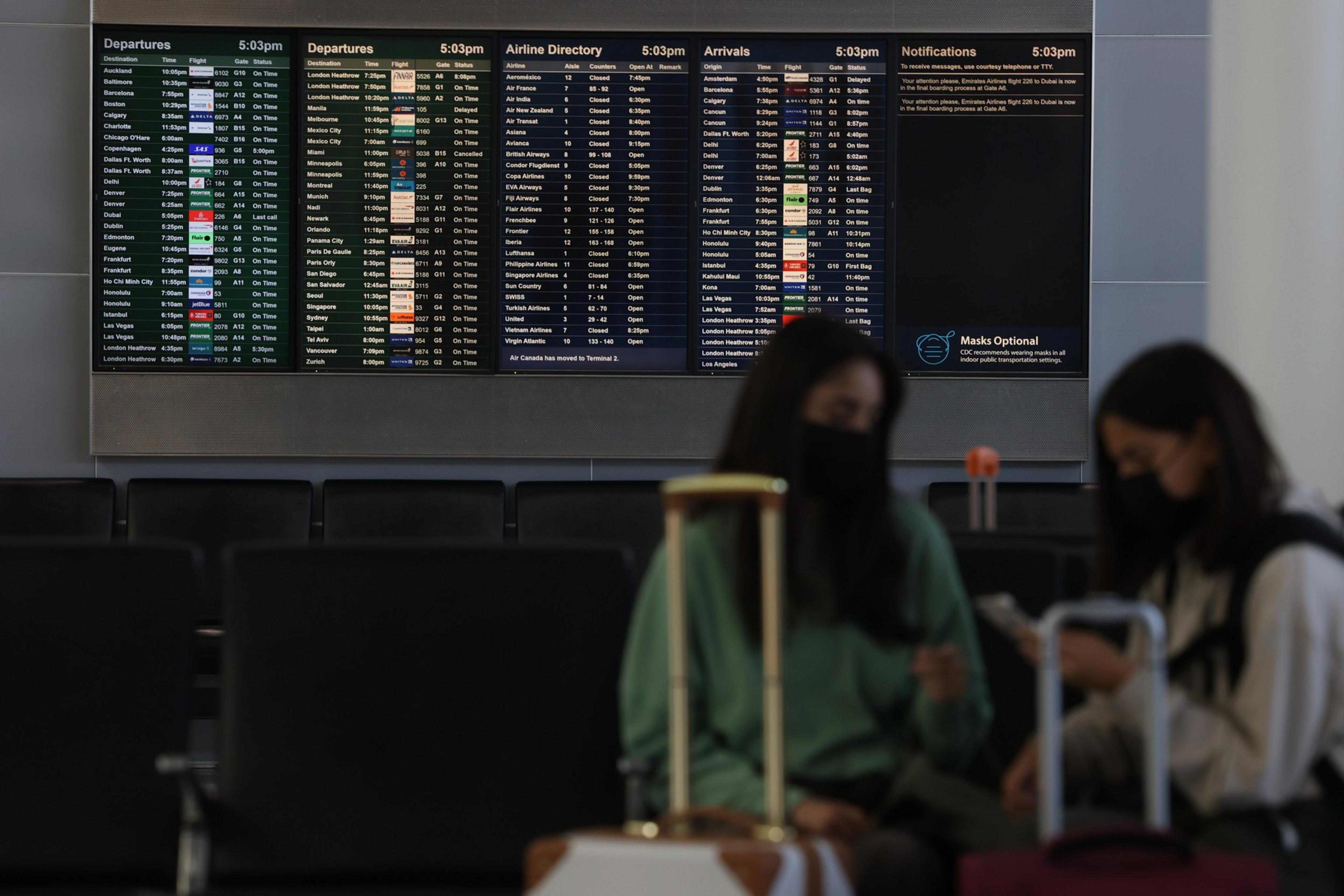 Maha and Ayla Parsons wait for their flight to London in the San Francisco International Airport on June 9, 2022. | Camille Cohen/The Standard