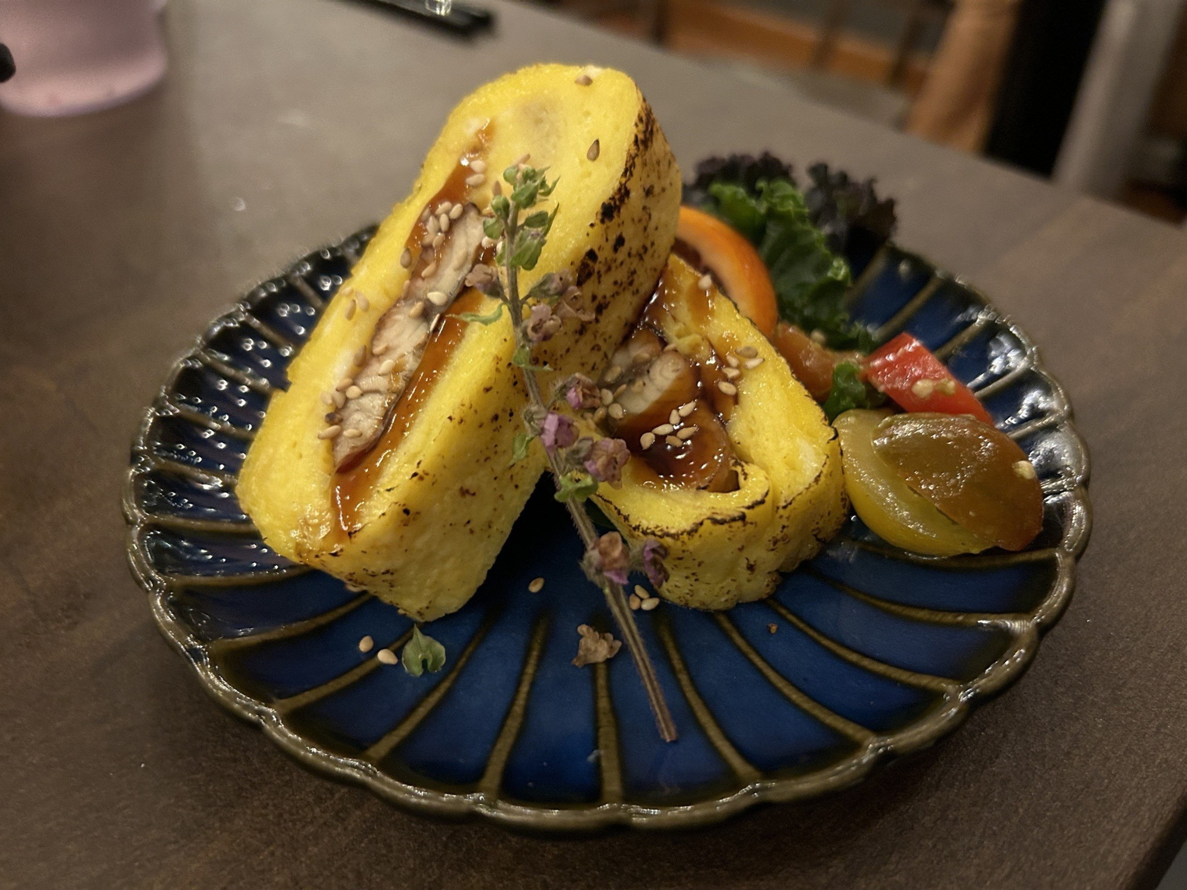 two servings of egg with eel, artfully presented as a duo