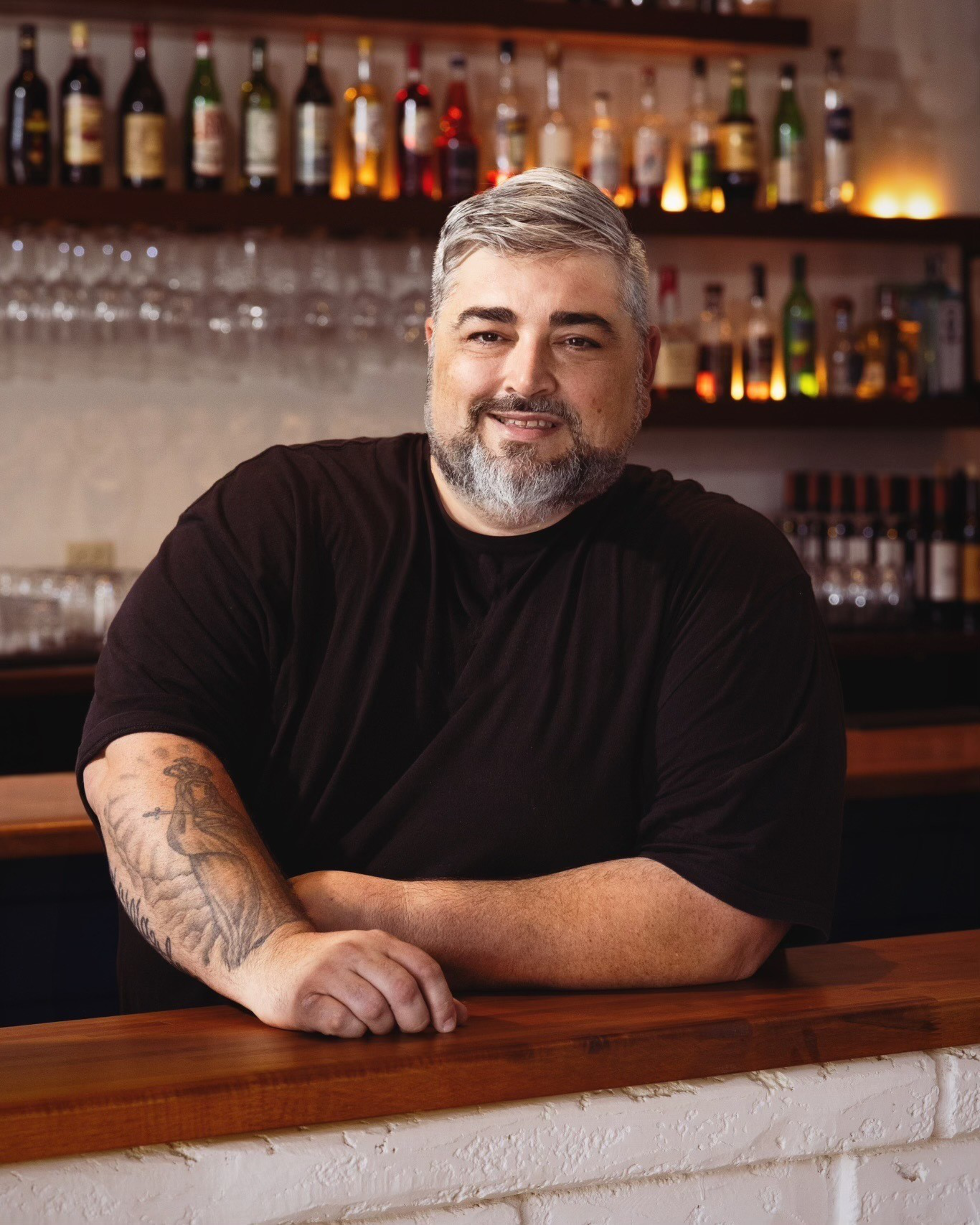 A man smiling for a portrait