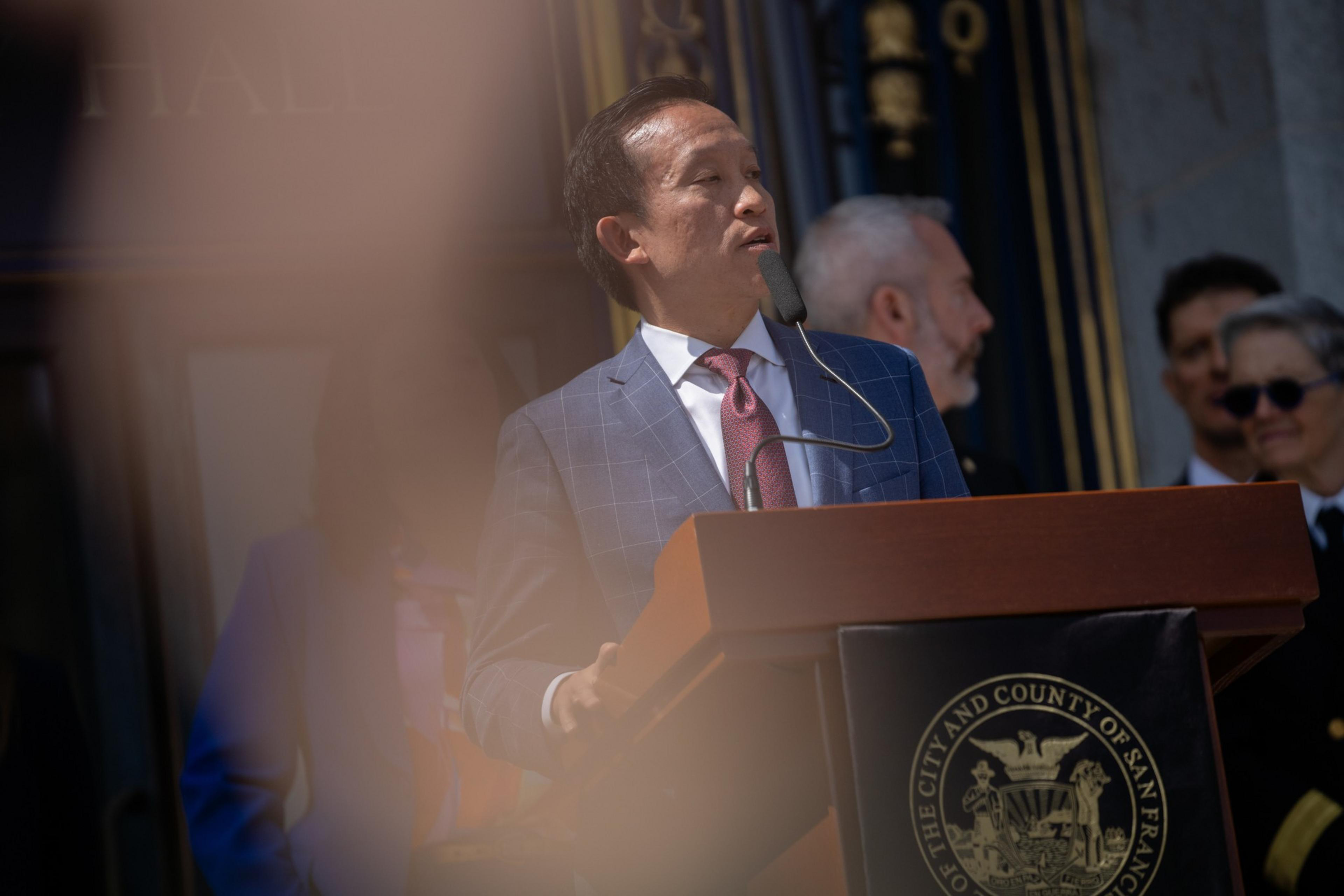 Man speaks before a crowd