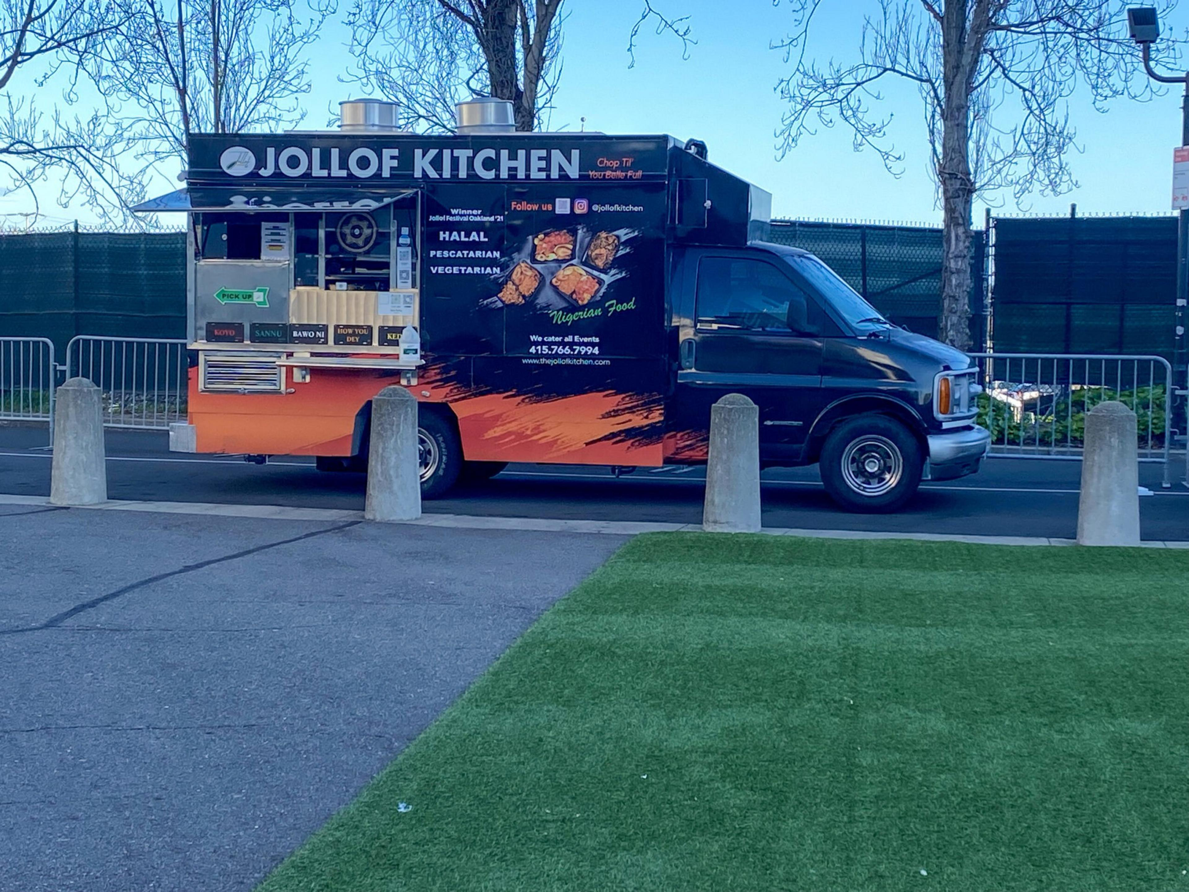 A black and orange food truck named Jollof Kitchen offers Halal, pescatarian, and vegetarian Nigerian food, with contact and social media information displayed.