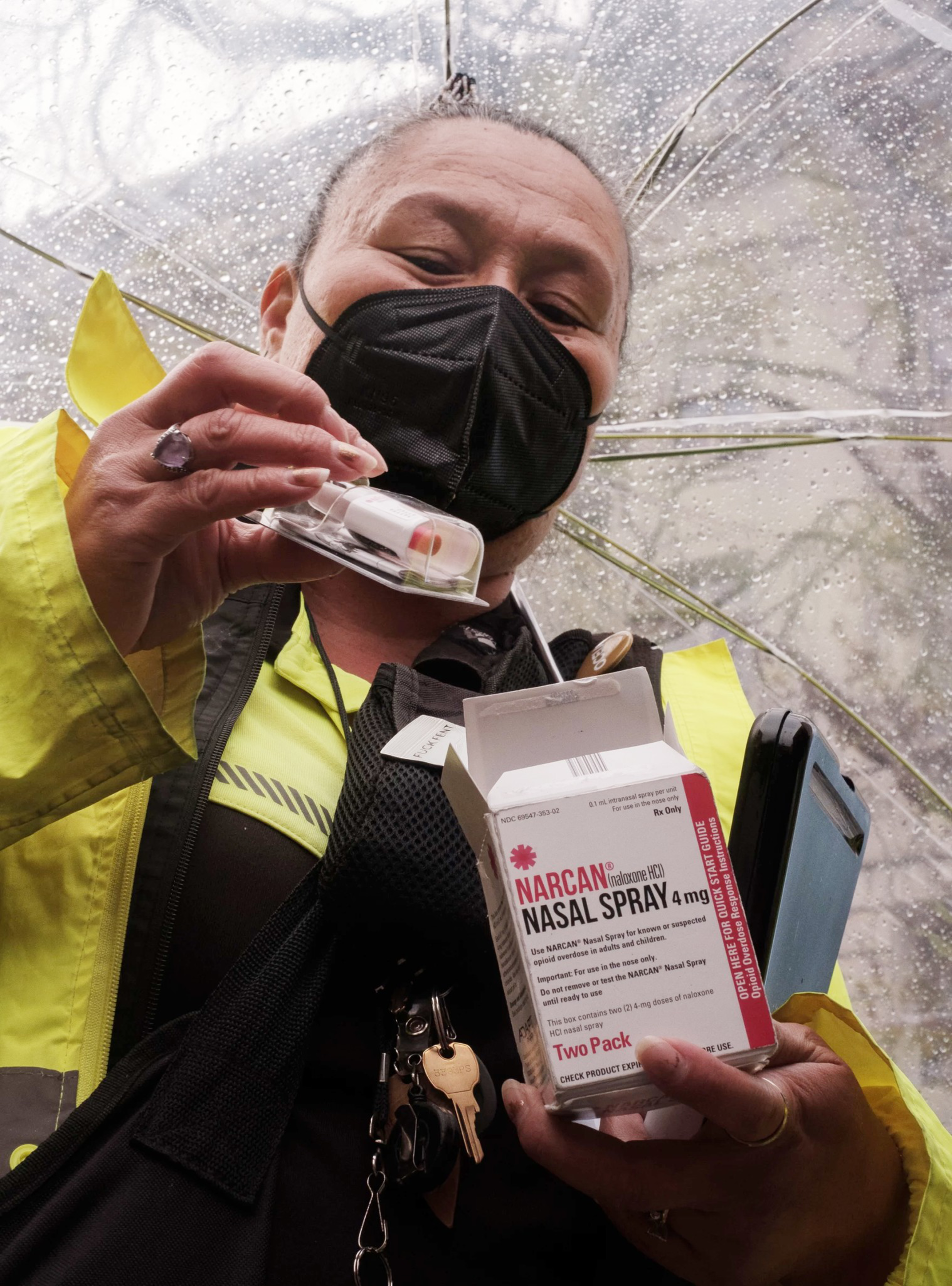 A woman hold an anti overdose kit.