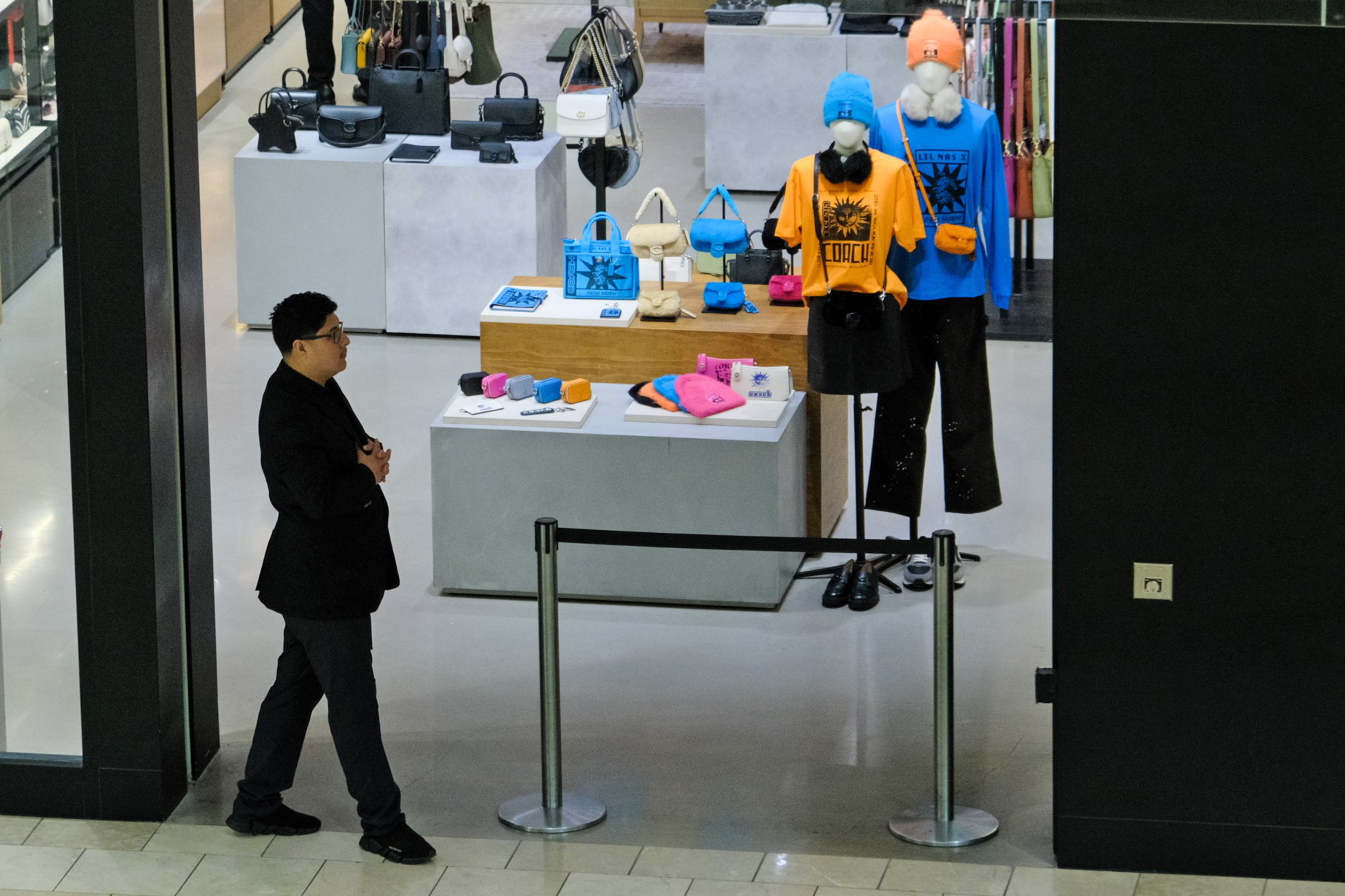 security guard stands in front of store
