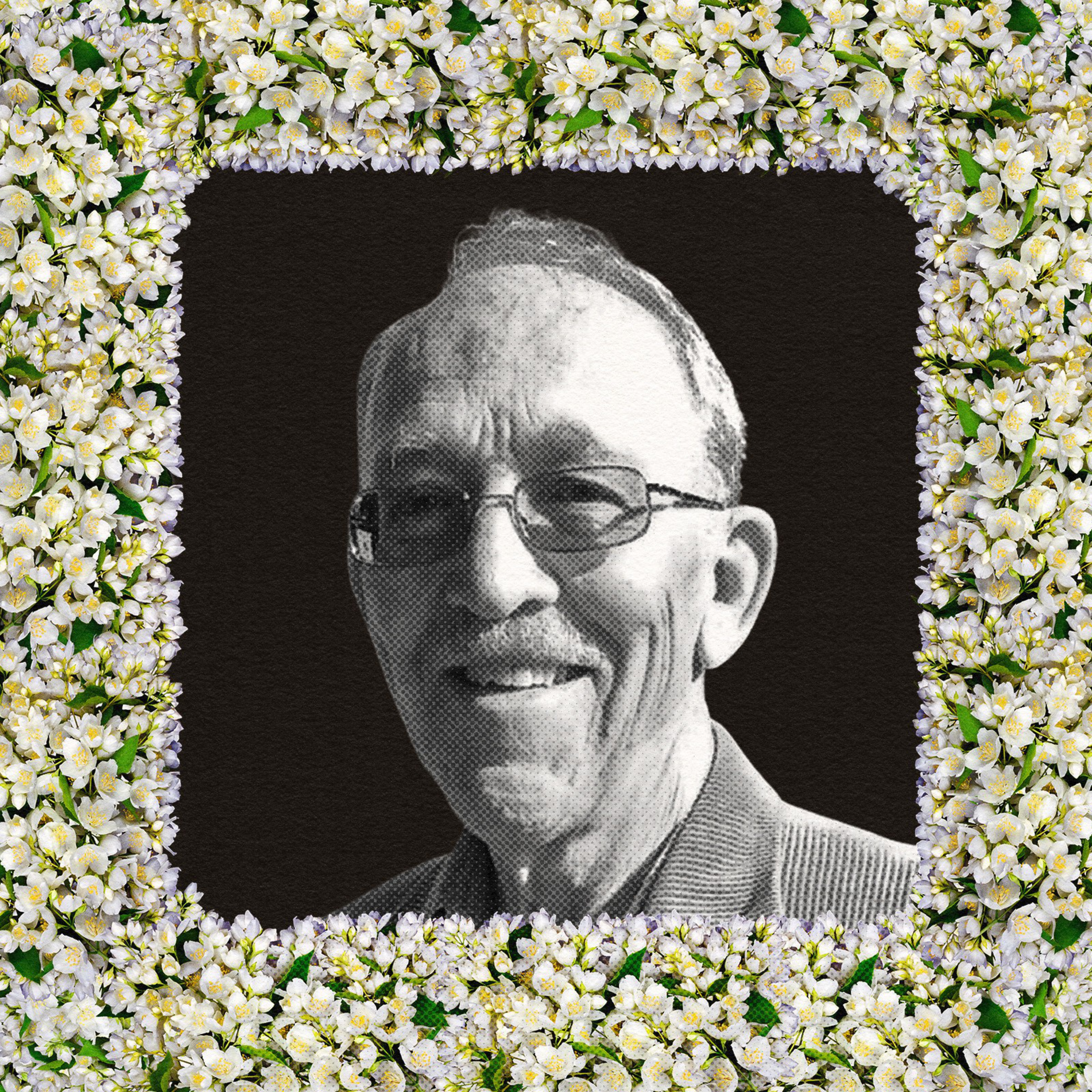 A portrait of a man surrounded by flowers.