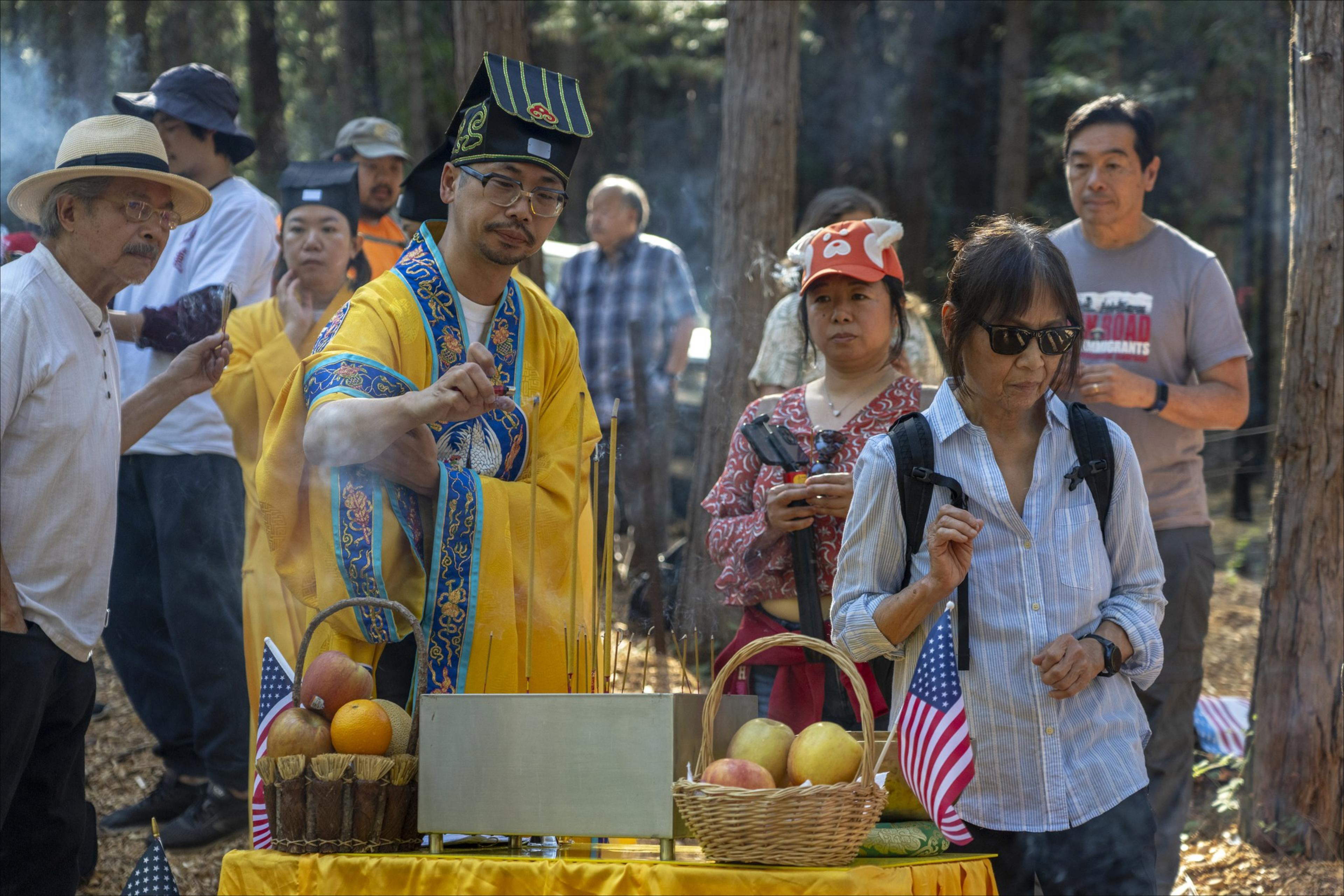 People lightning incense in the a Forrest area.
