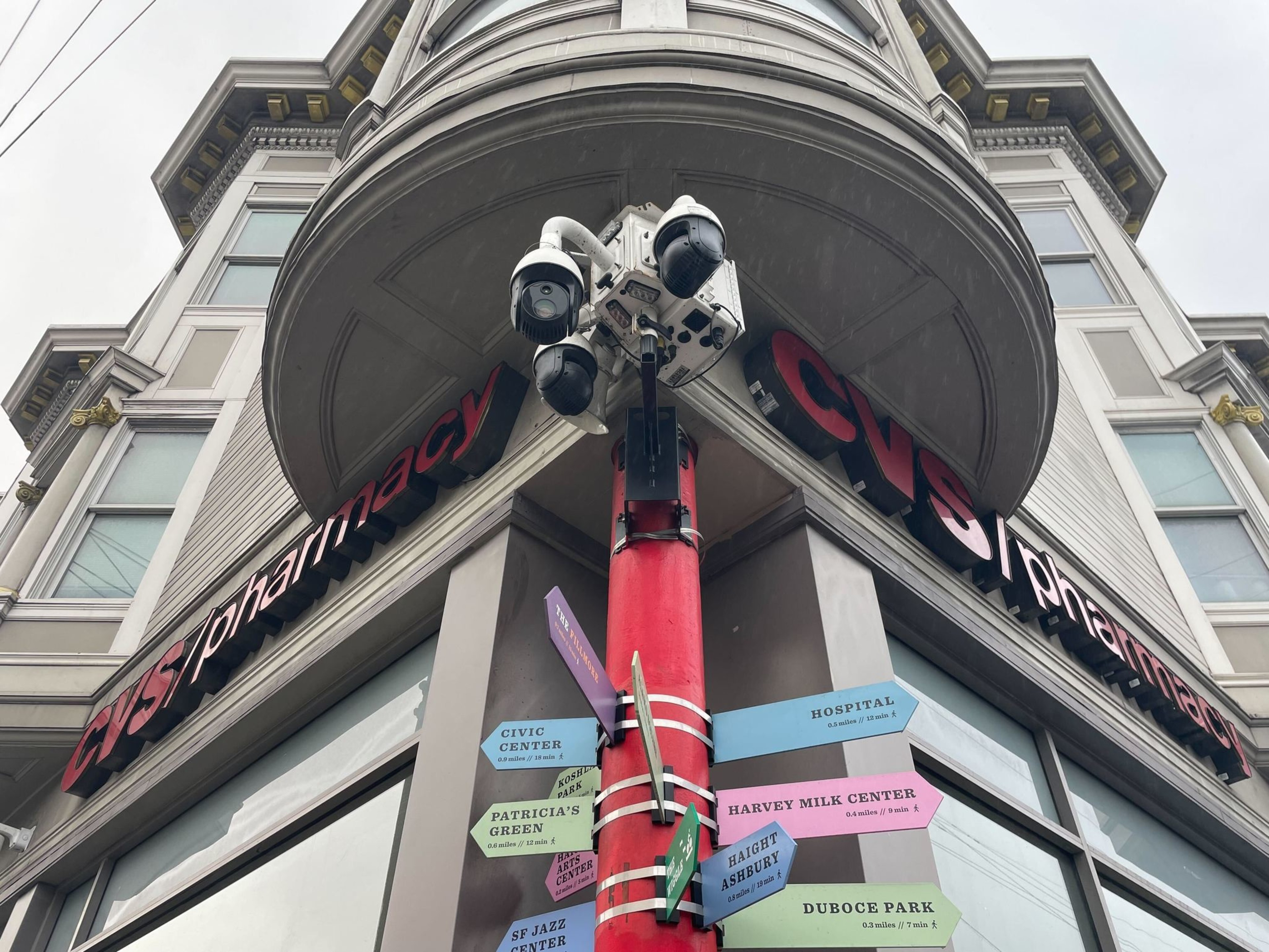 Security cameras affixed to corner building exterior