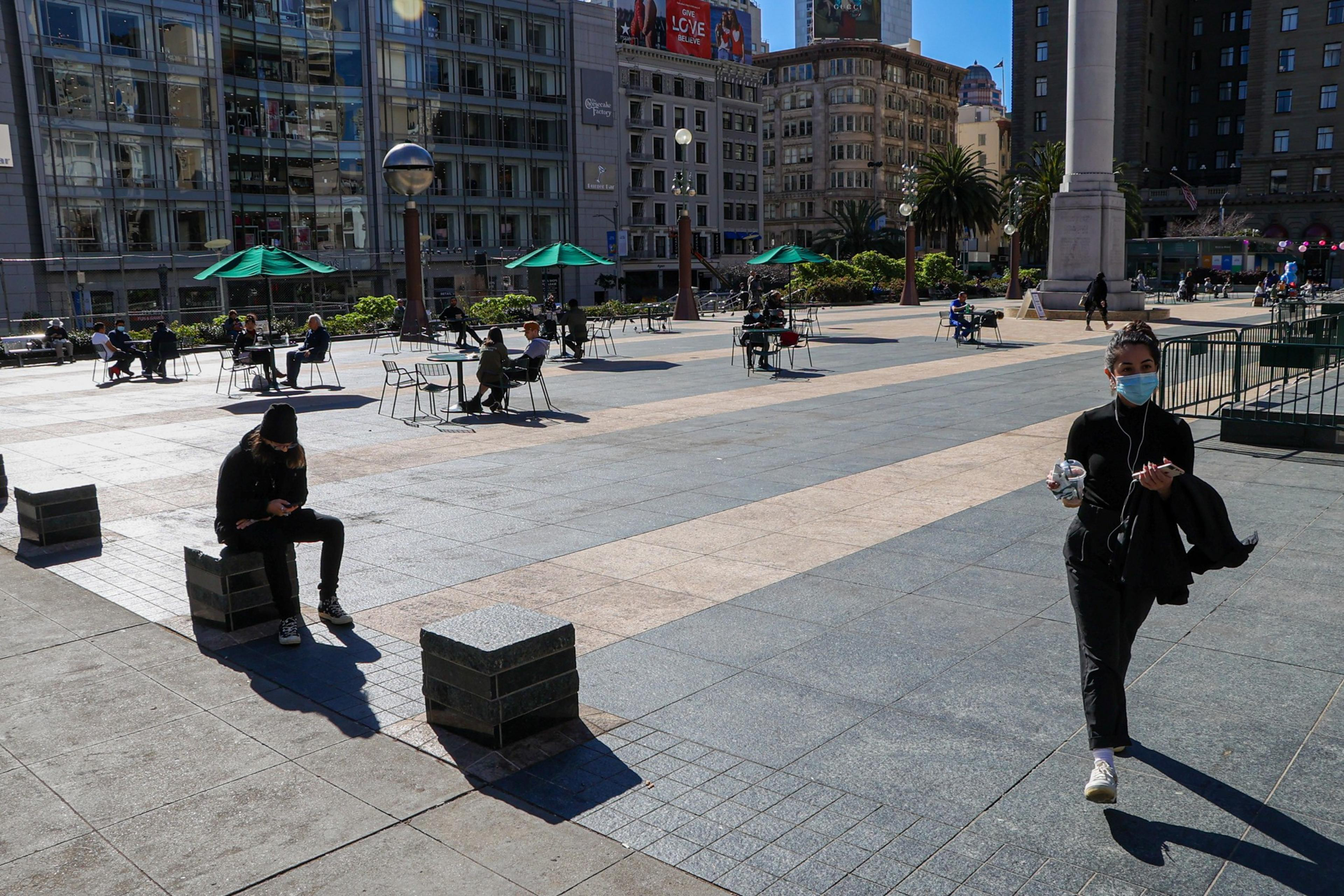 Tourists and San Francisco residents stroll the Financial District and Union Square on Feb. 1, 2022.