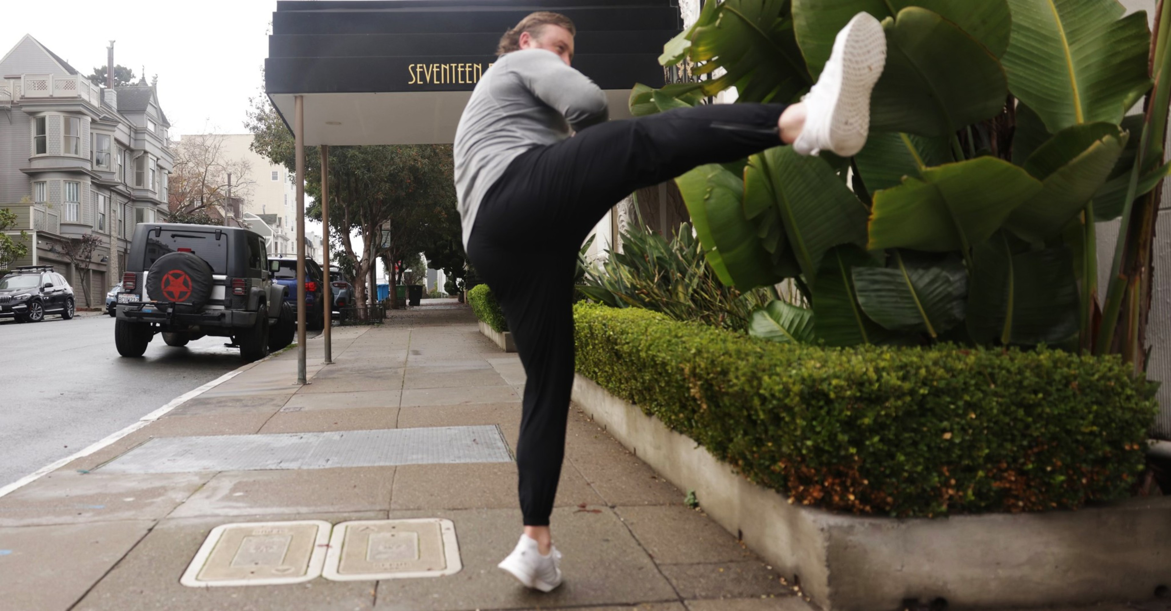 A man performs a flying kick