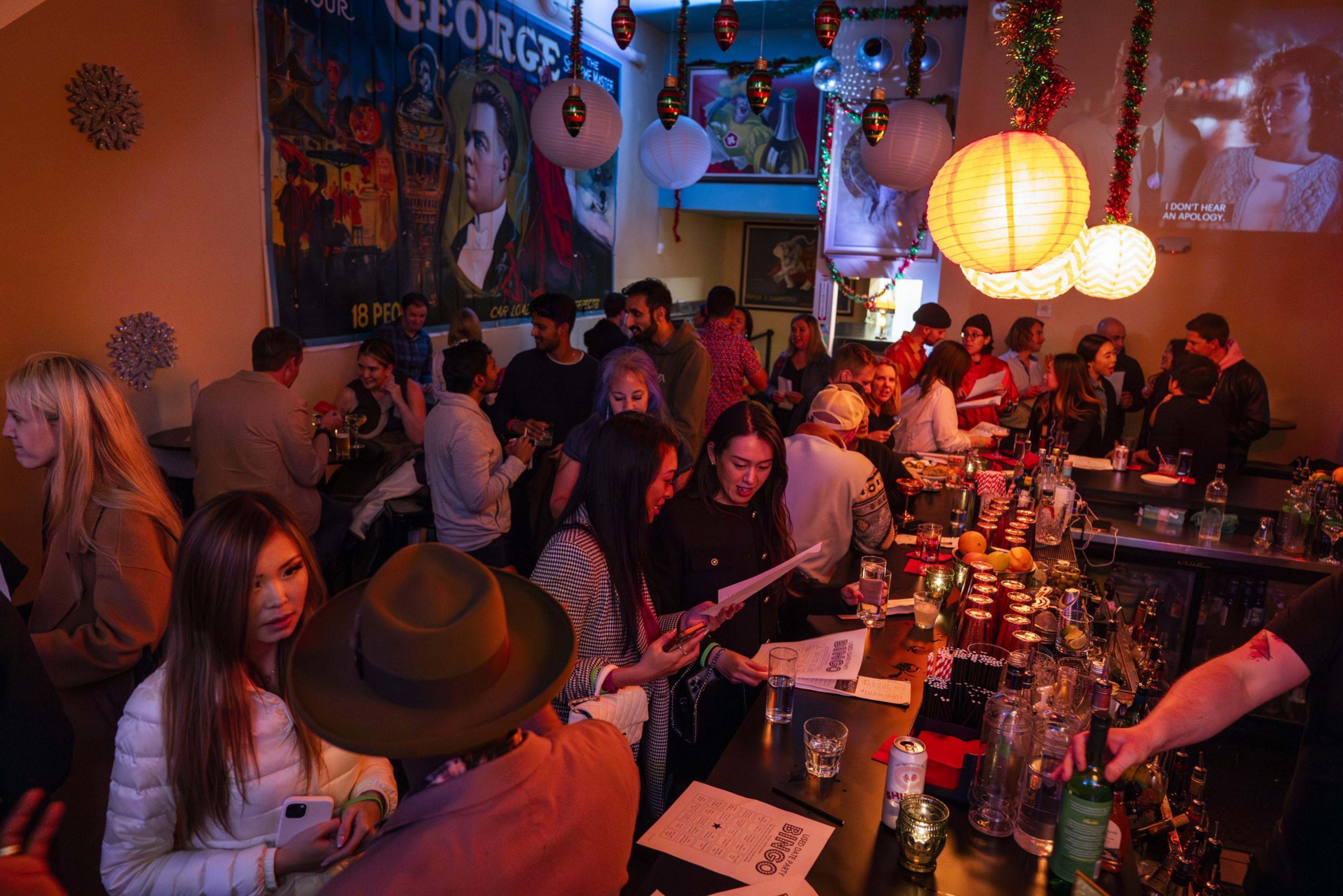 People gather in a bar for a singles mixer.