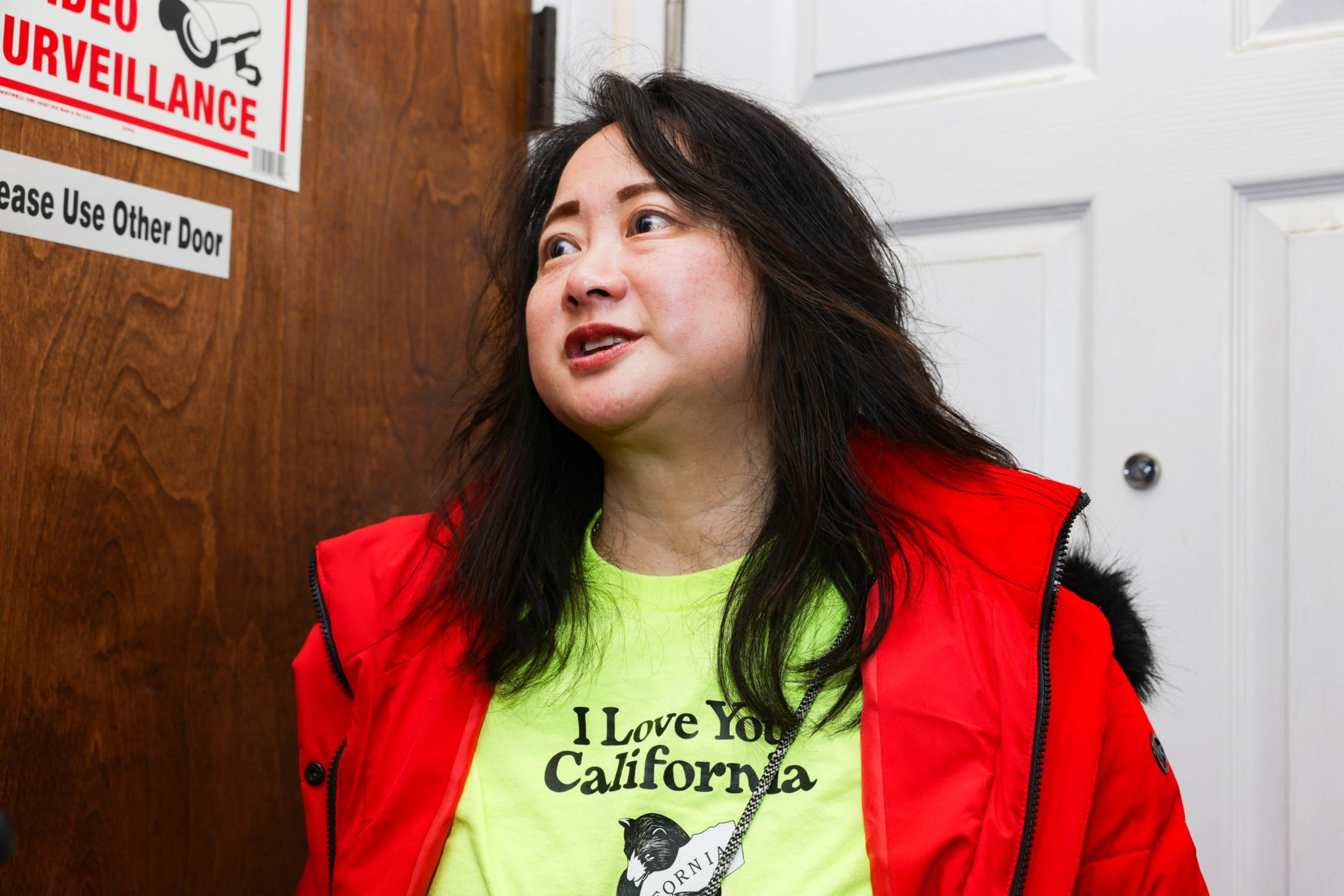 Gina Tse-Louie talking outside of her office on Taraval Street.