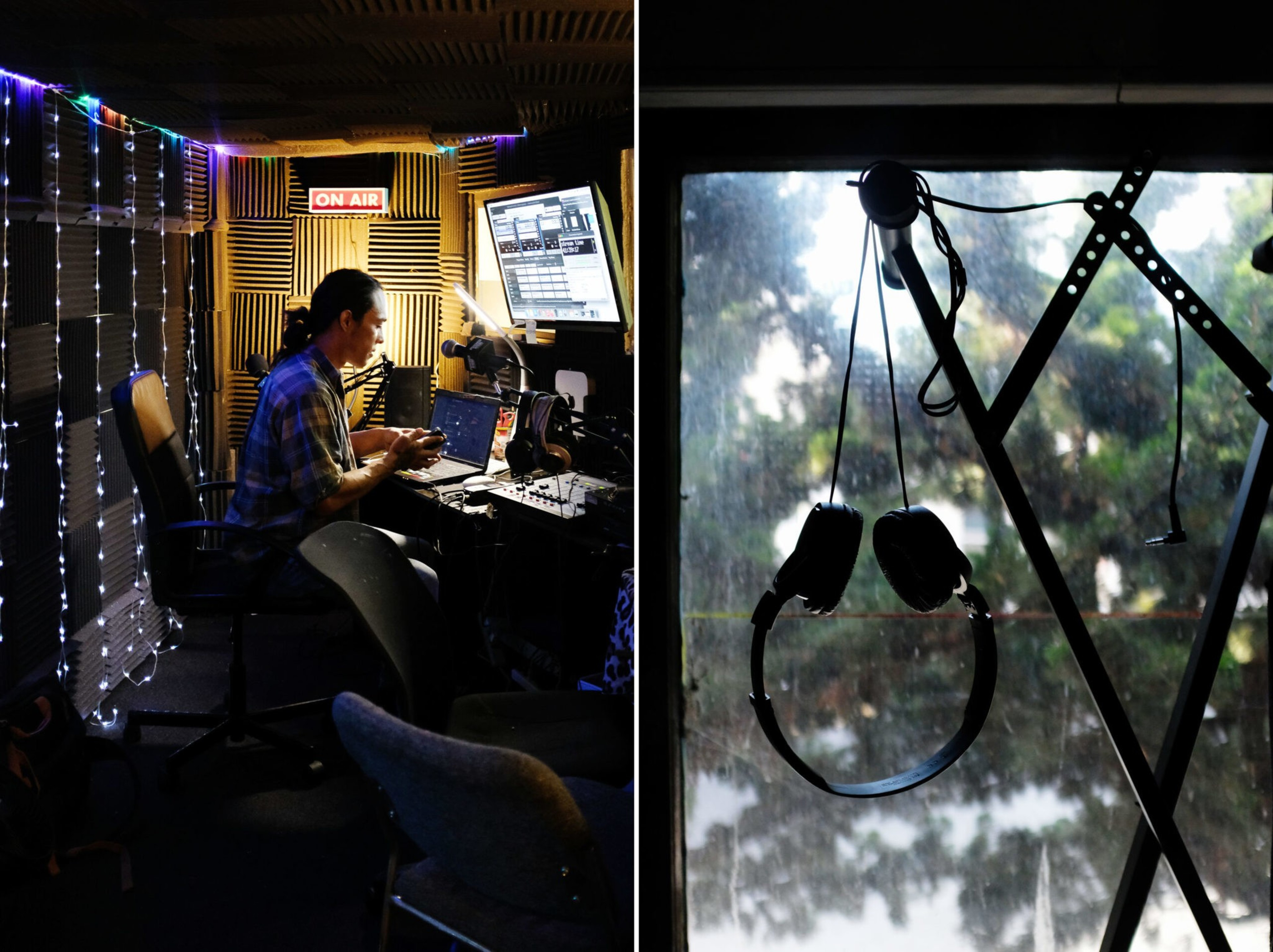 A person wearing a plaid shirt works in a dimly lit recording studio with an "ON AIR" sign while headphones hang on a window frame in natural light.