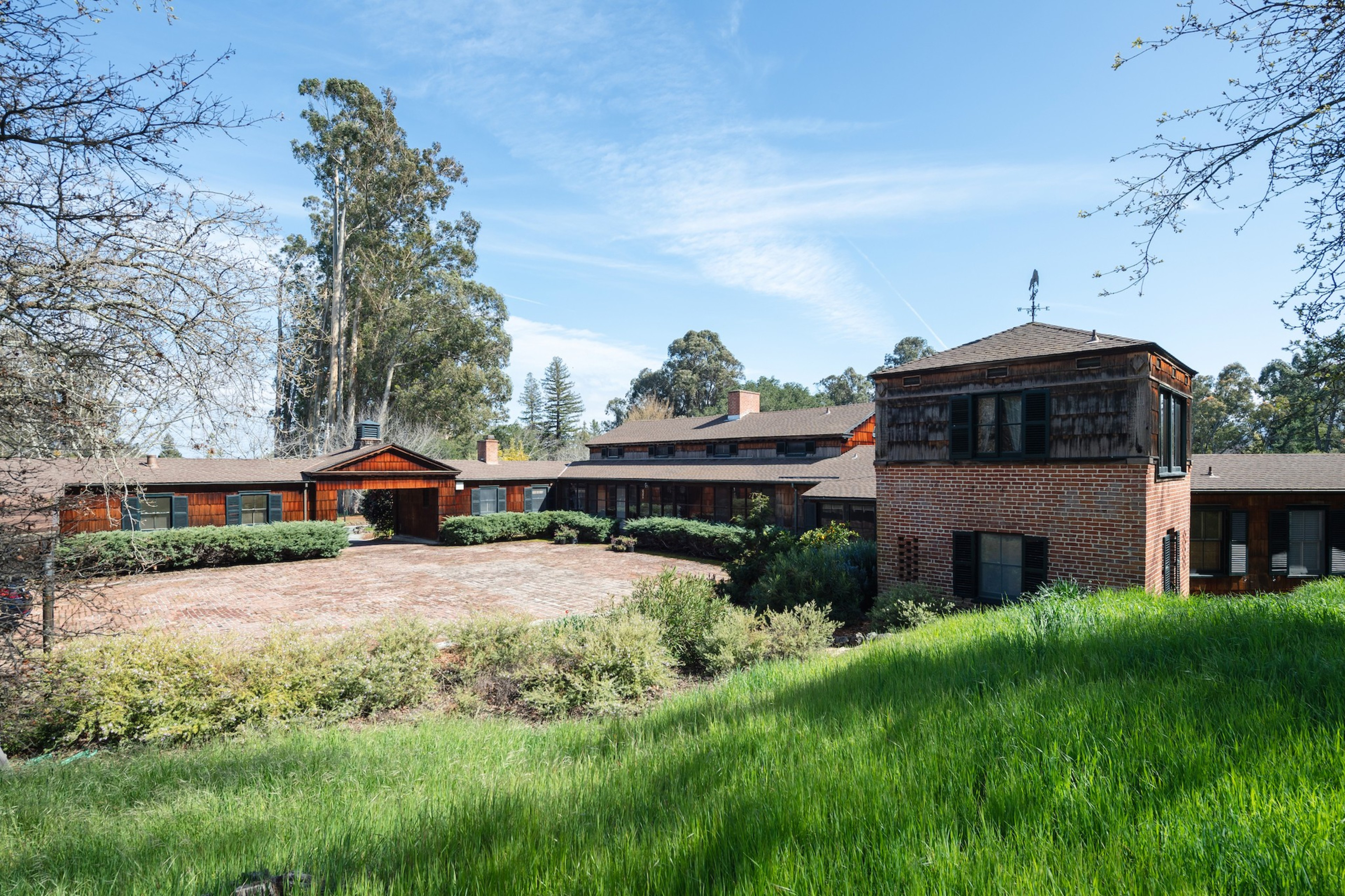 A massive house with a green grace. 