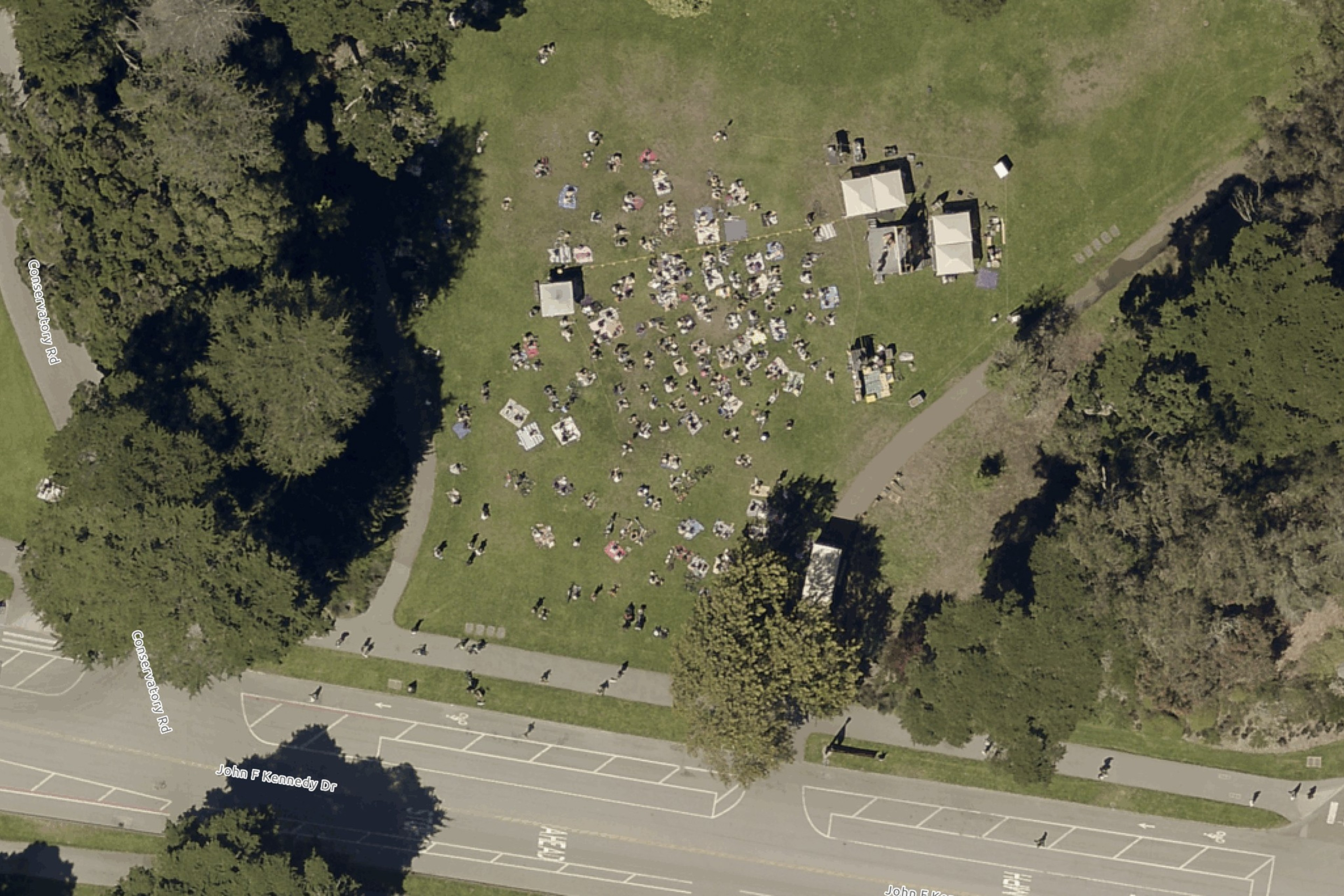 An aerial view of people enjoying Golden Gate Park along John F. Kennedy Drive at Conservatory Drive in 2022.
