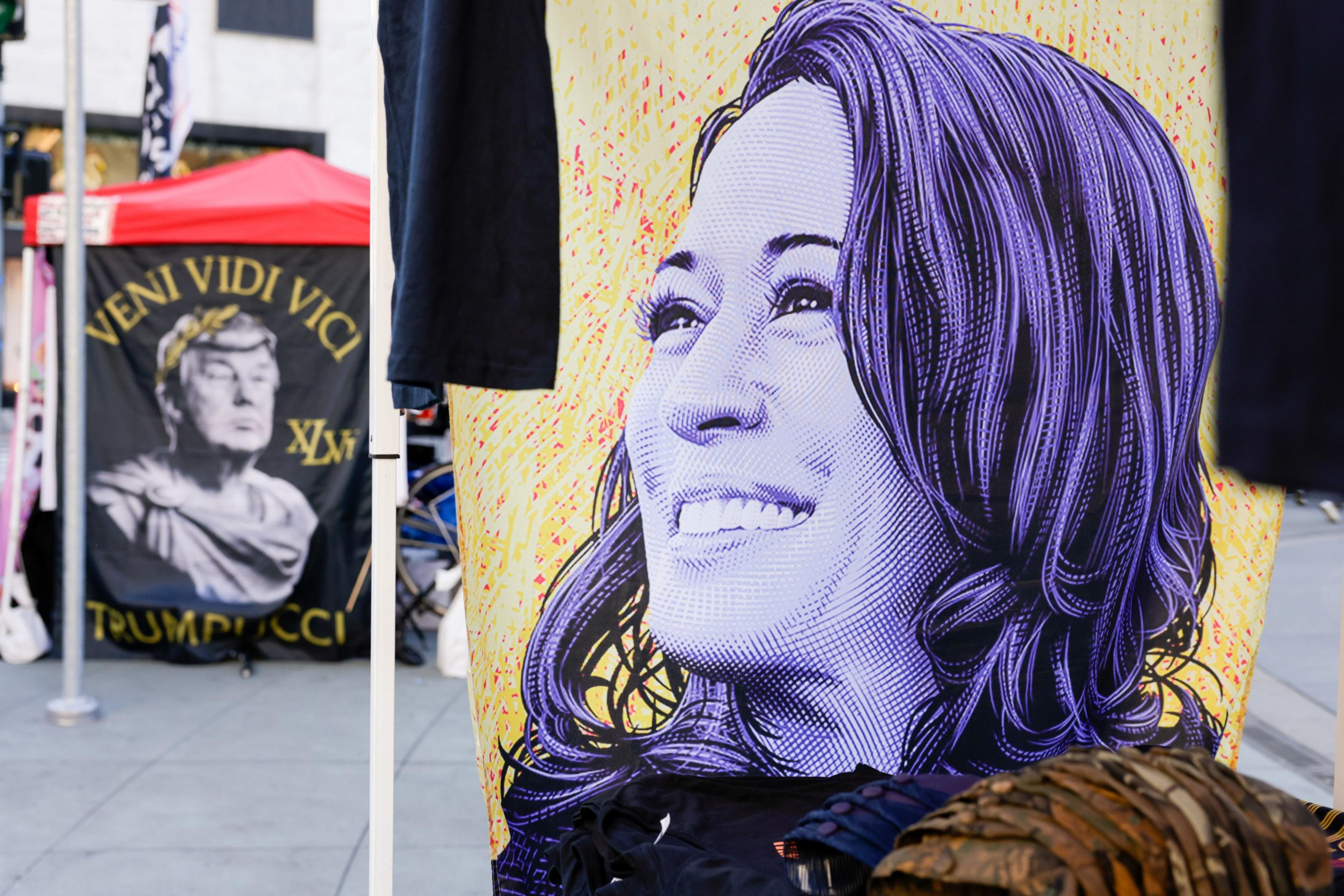 The image shows a vibrant, stylized portrait of a smiling woman. In the background is a banner with Roman-themed imagery and the words &quot;VENI VIDI VICI TRUMPICCI.&quot;