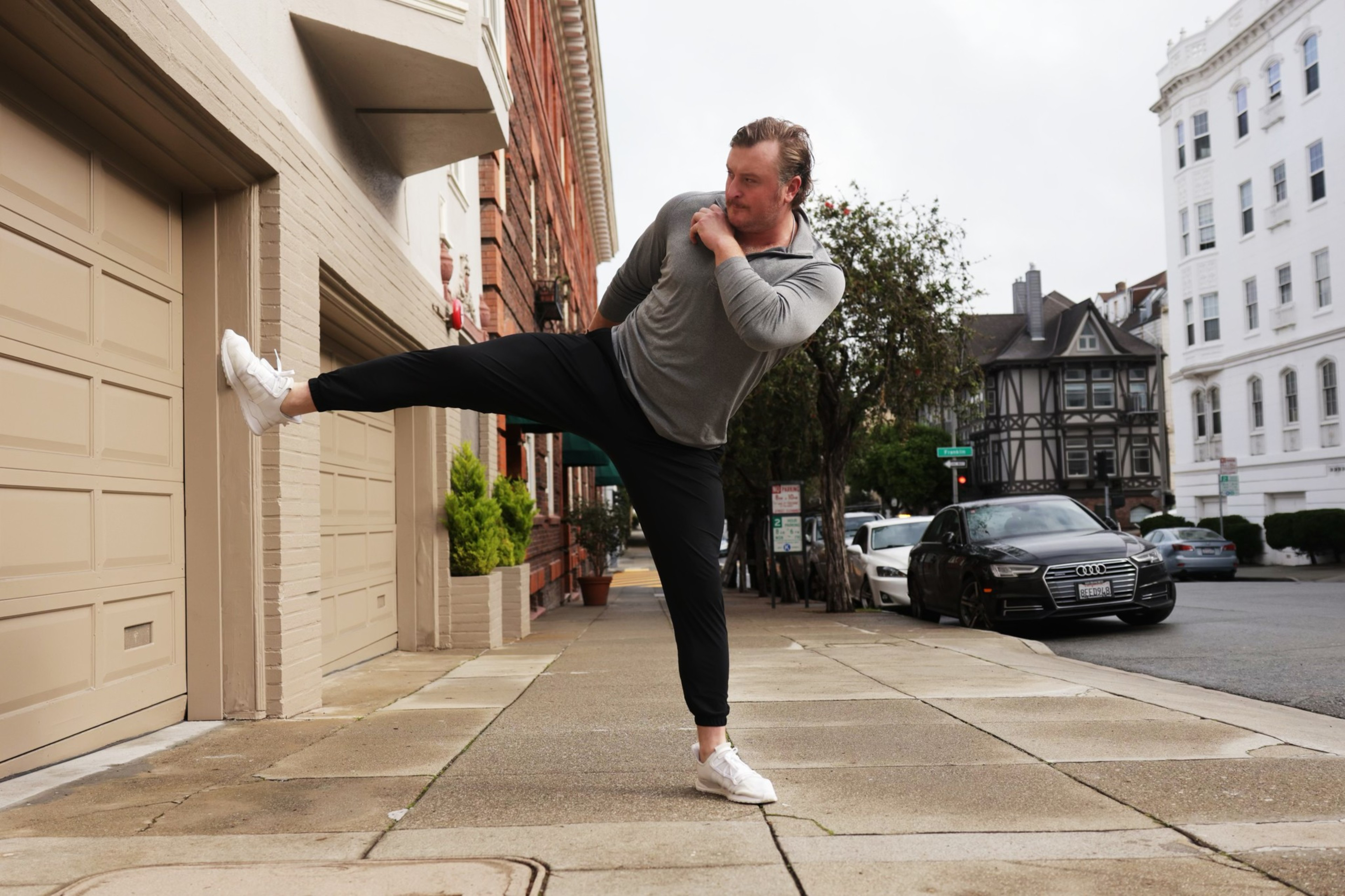 A man performs a flying kick