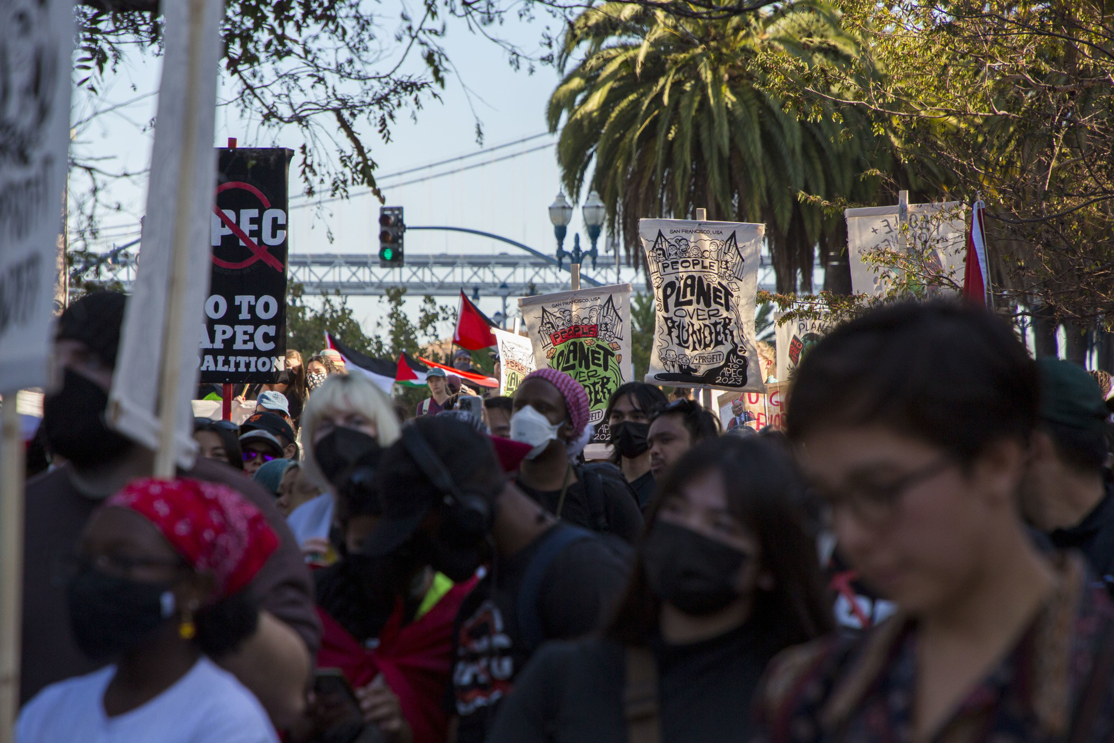Thousands of people marched through San Francisco holding signs that read &quot;Planet over Plunder&quot; and &quot;No 2 APEC&quot;.