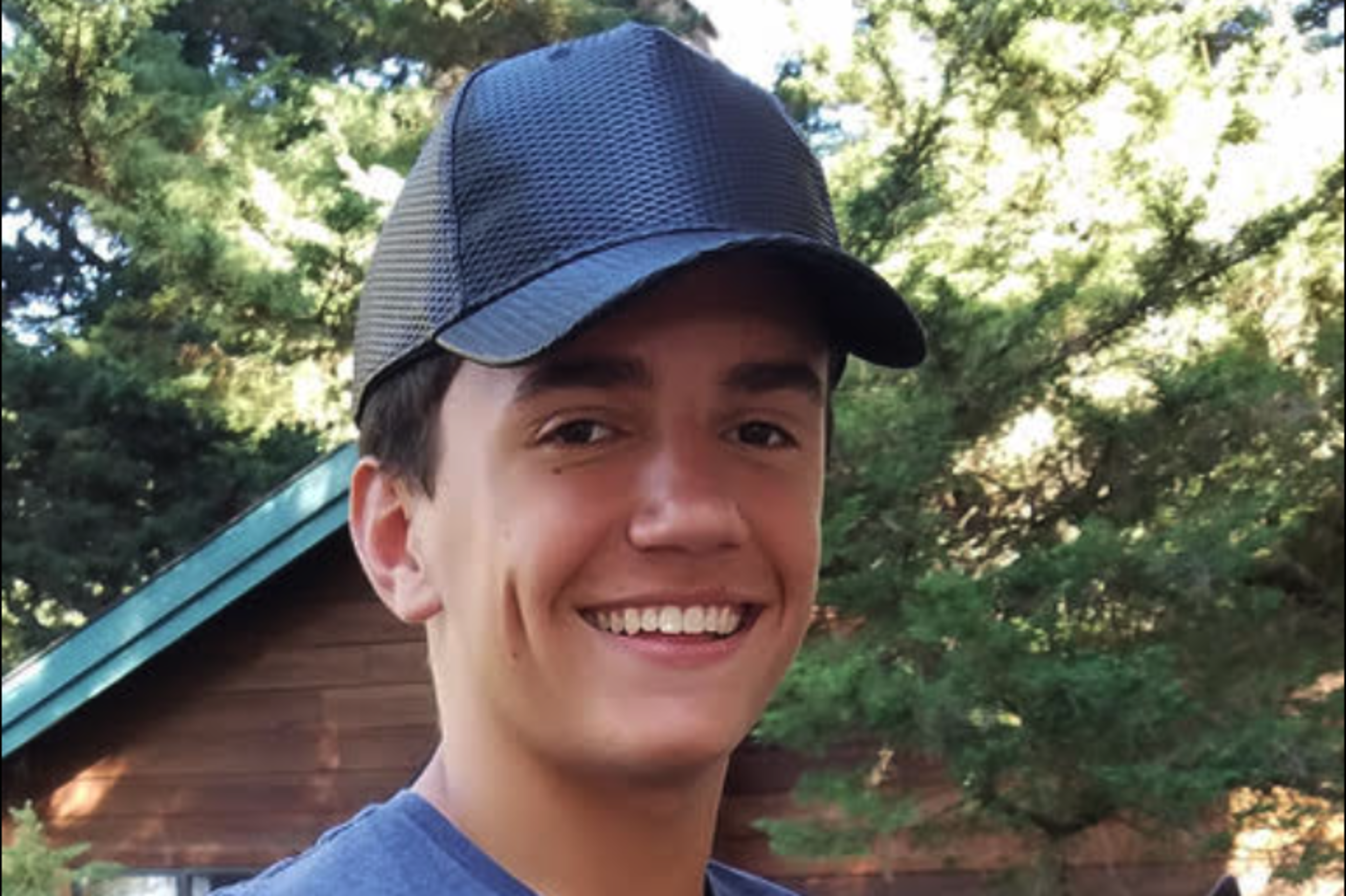 A boy poses for a photo.