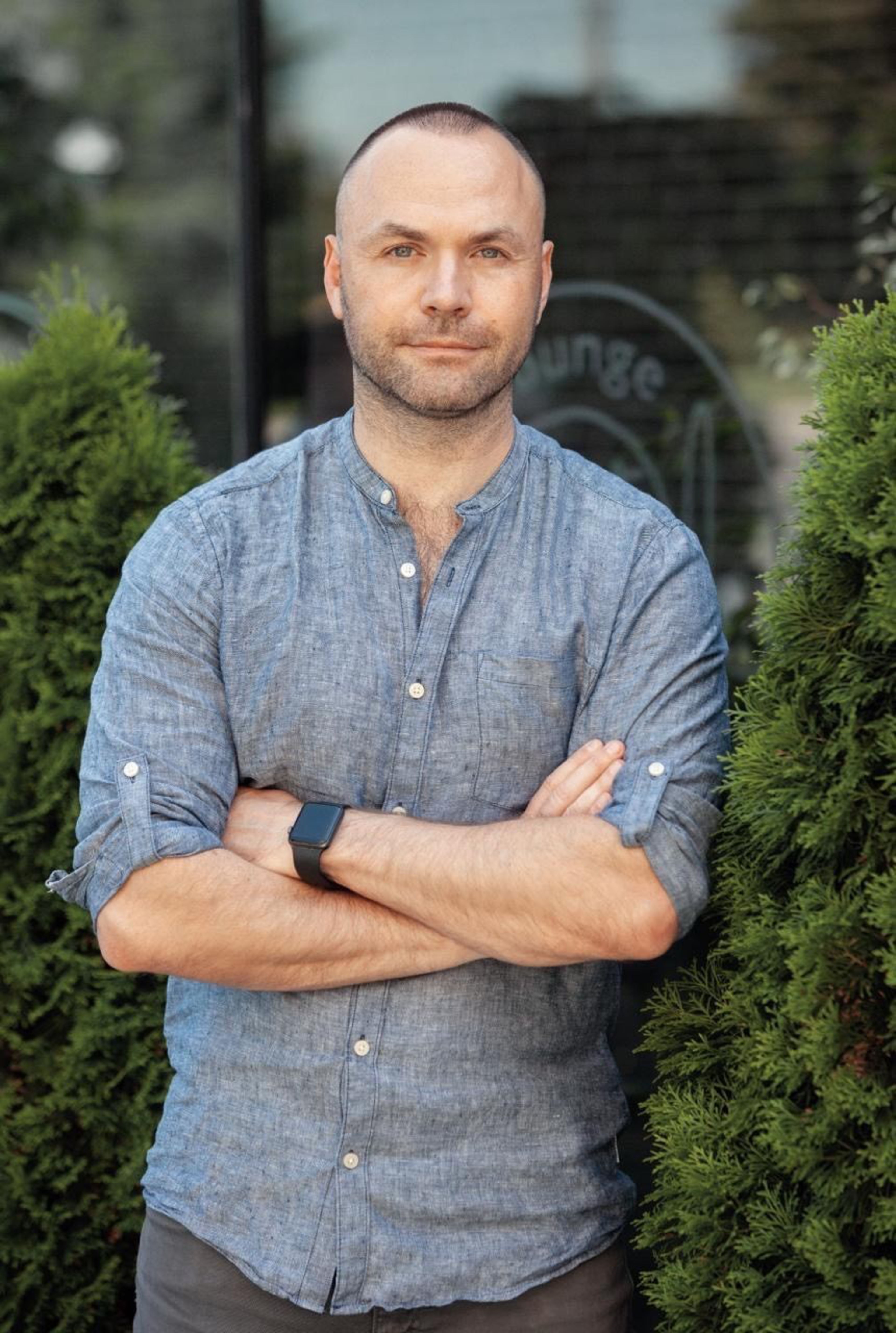A man smiling and looking at the camera