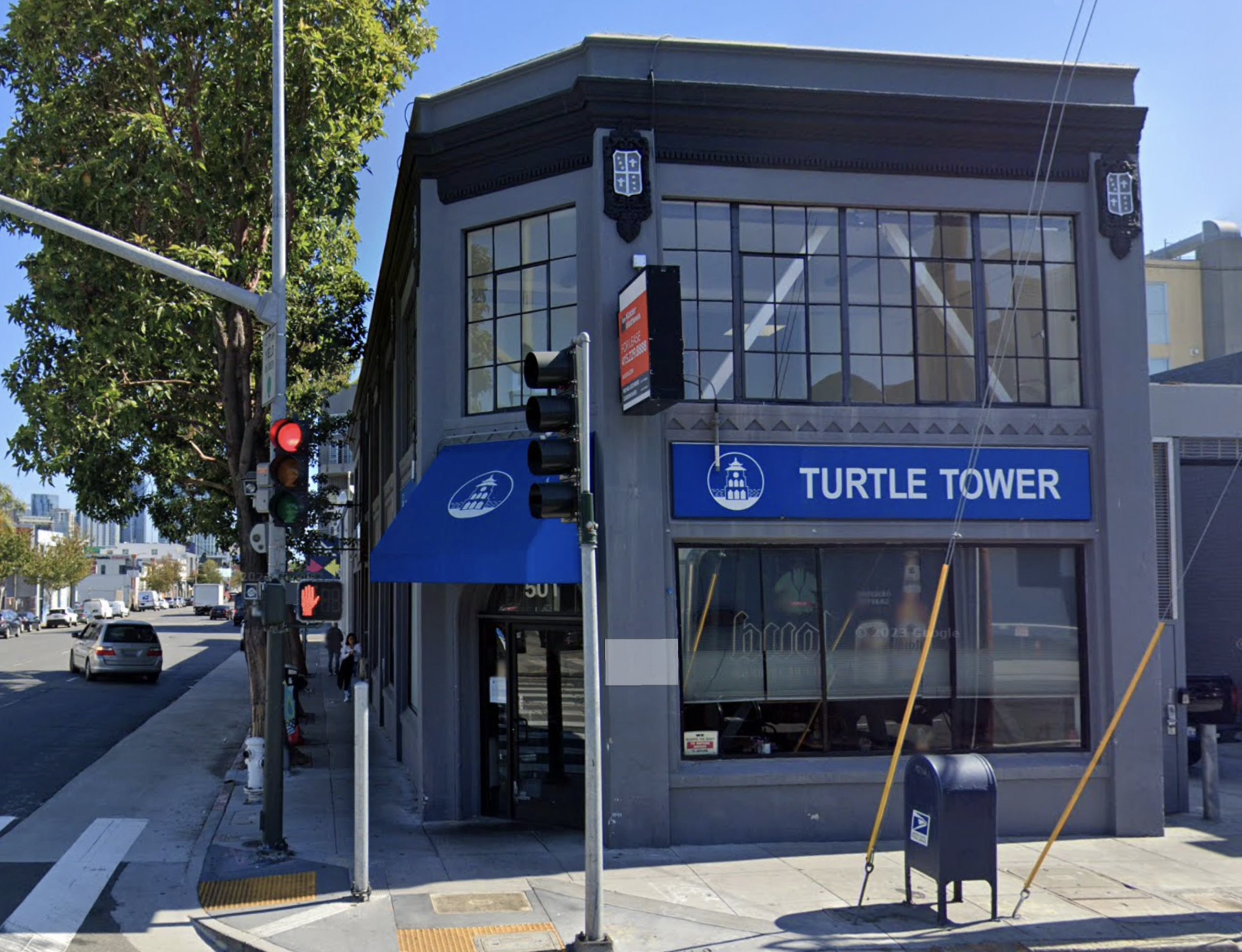 a restaurant stands on a busy street corner.