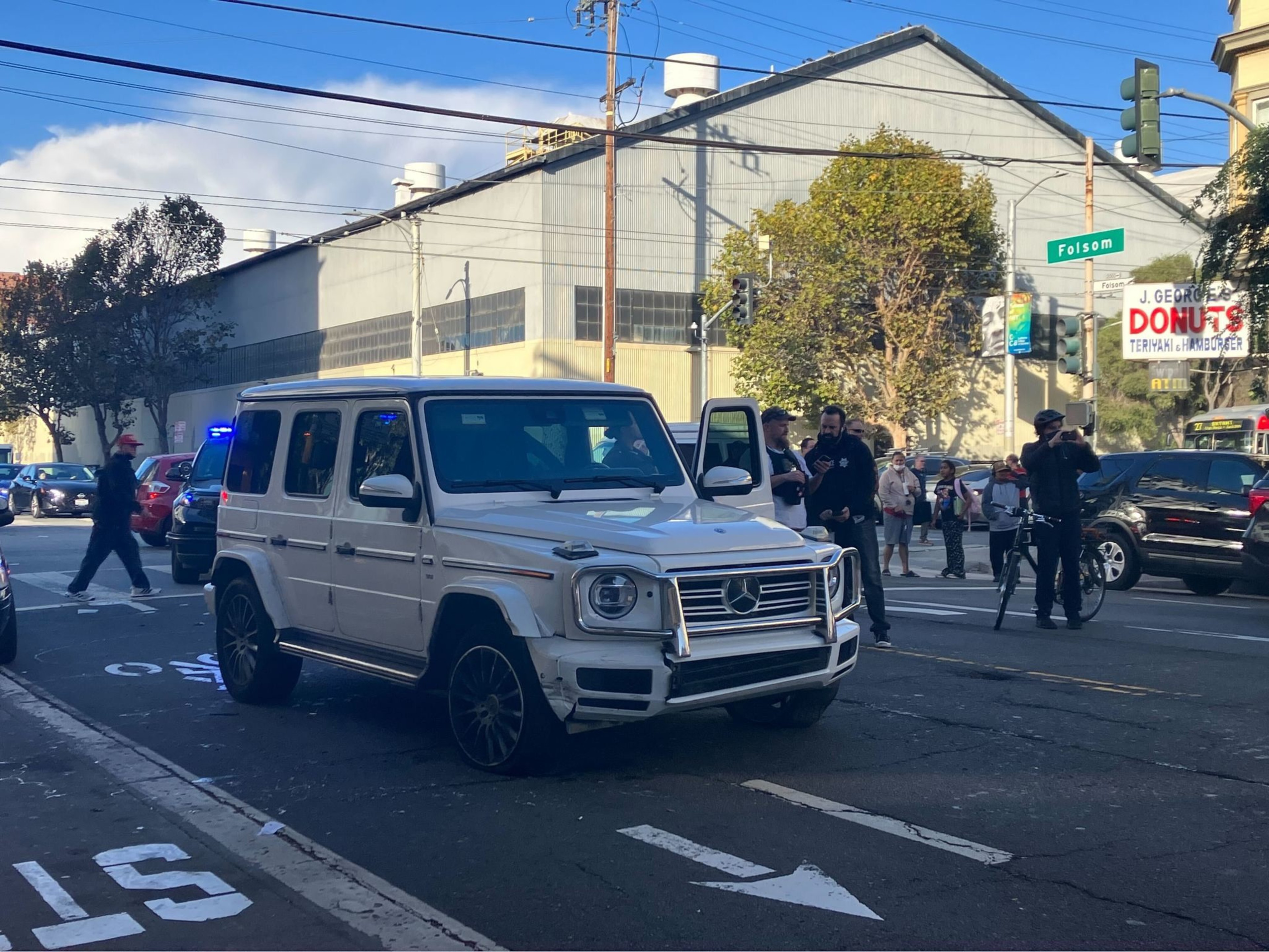 a white vehicle is surrounded by police 