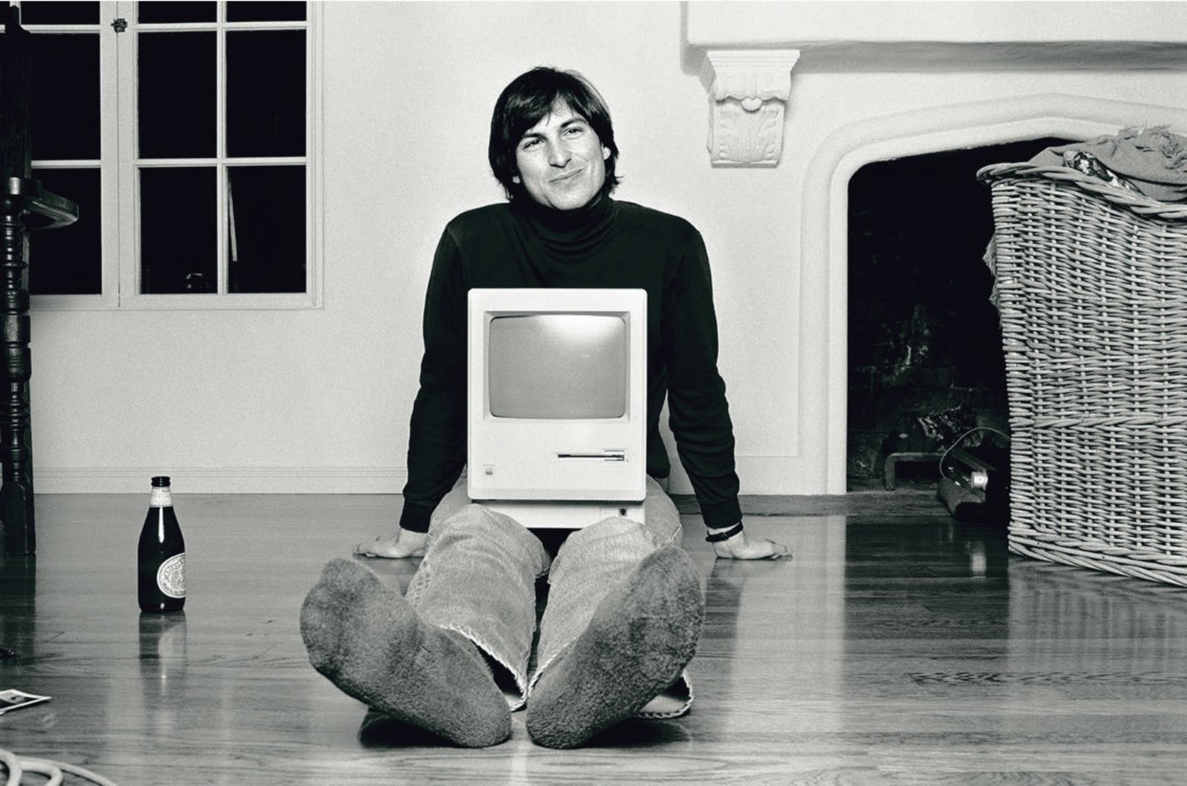 Man with computer and beer bottle