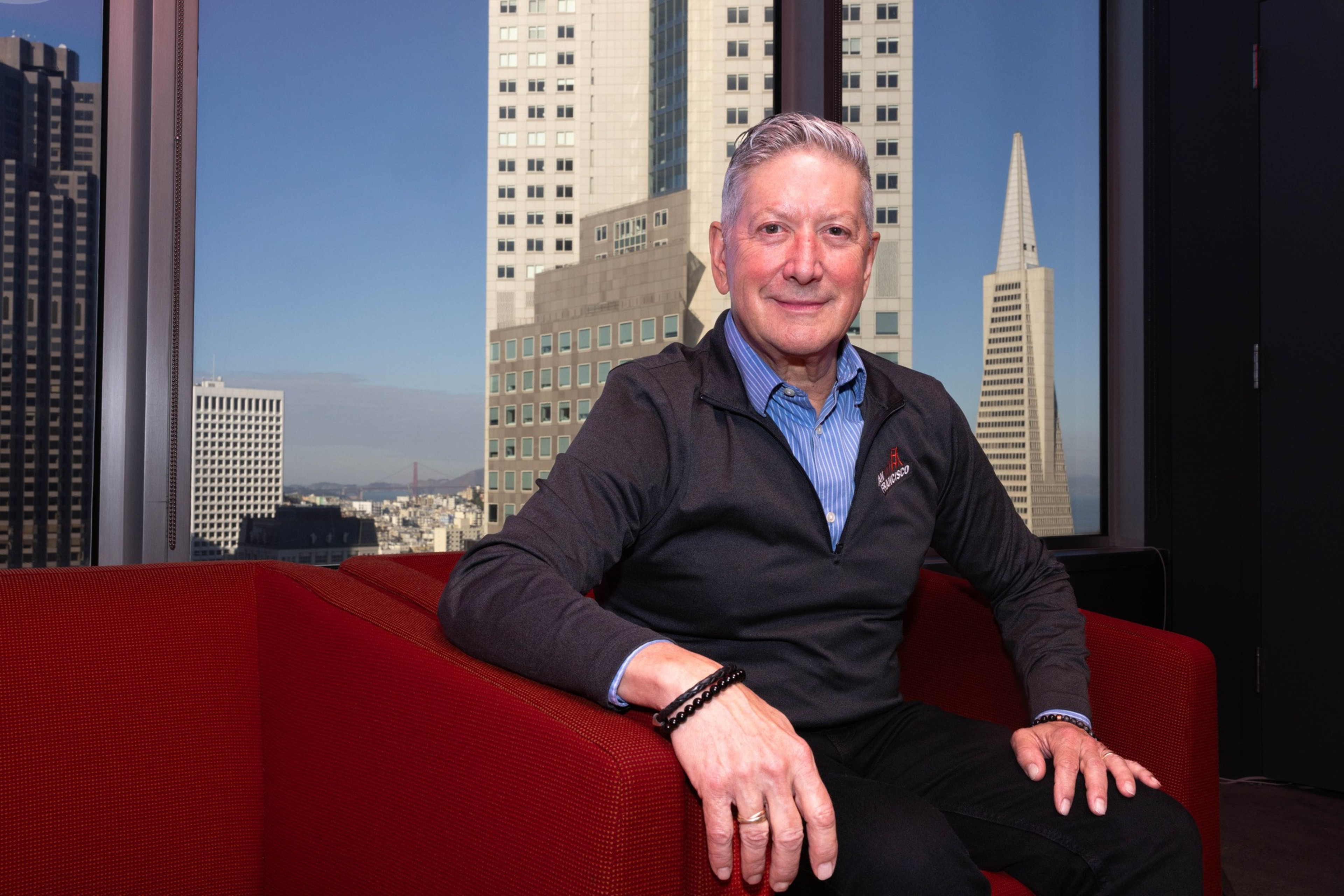 Joe Dâ€™ Alessandro sits in an office looking over the city of San Francisco.