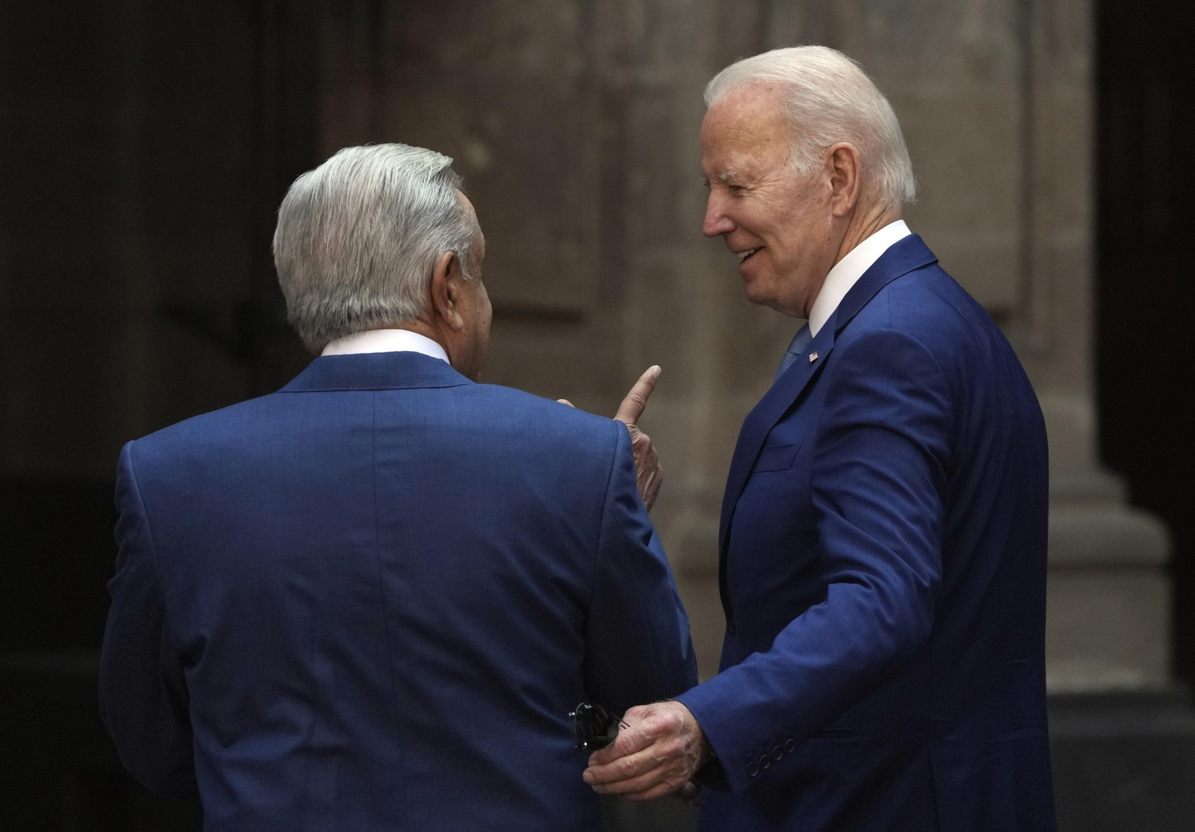 Two men in dark blue suits.