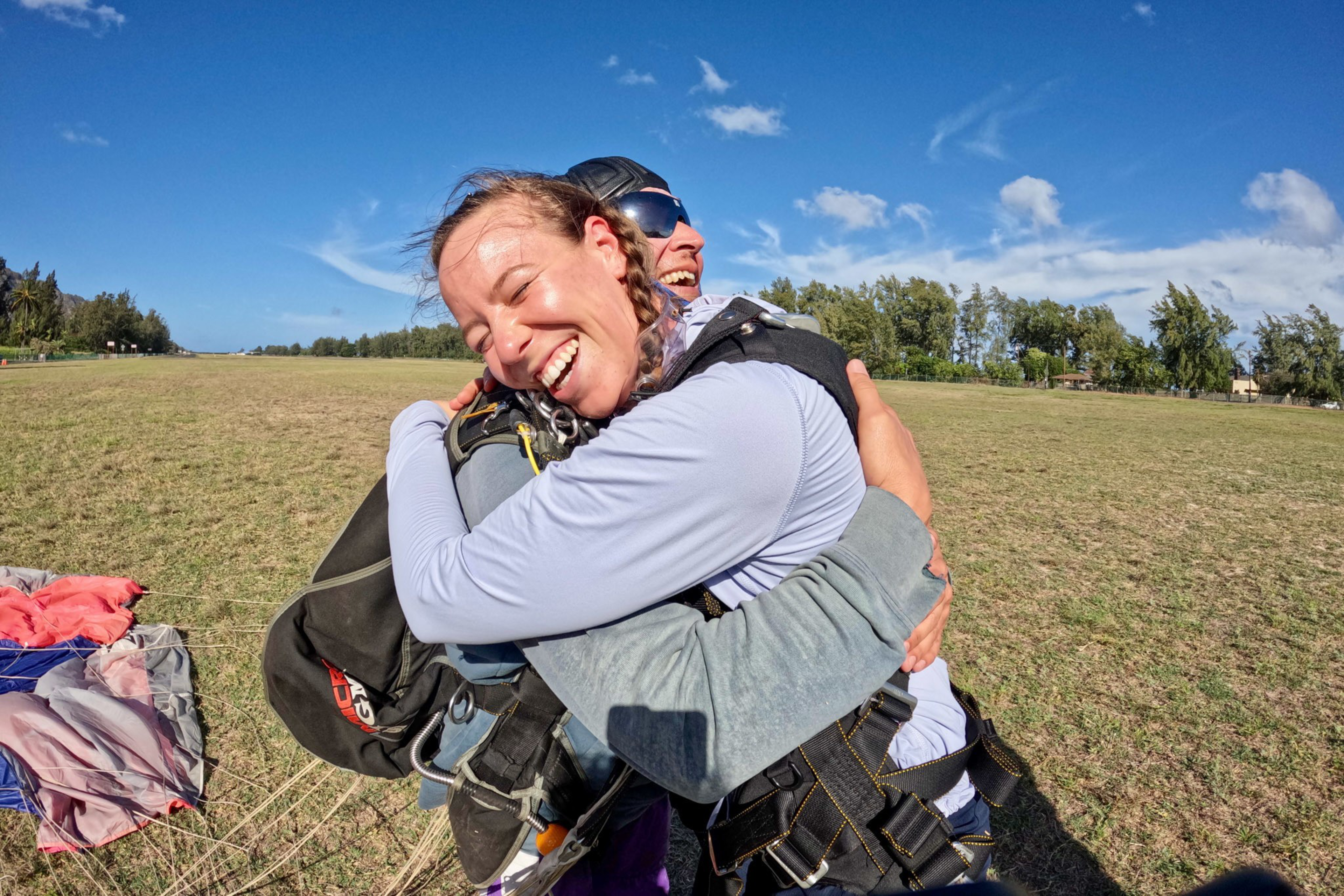 A woman and man hug. 