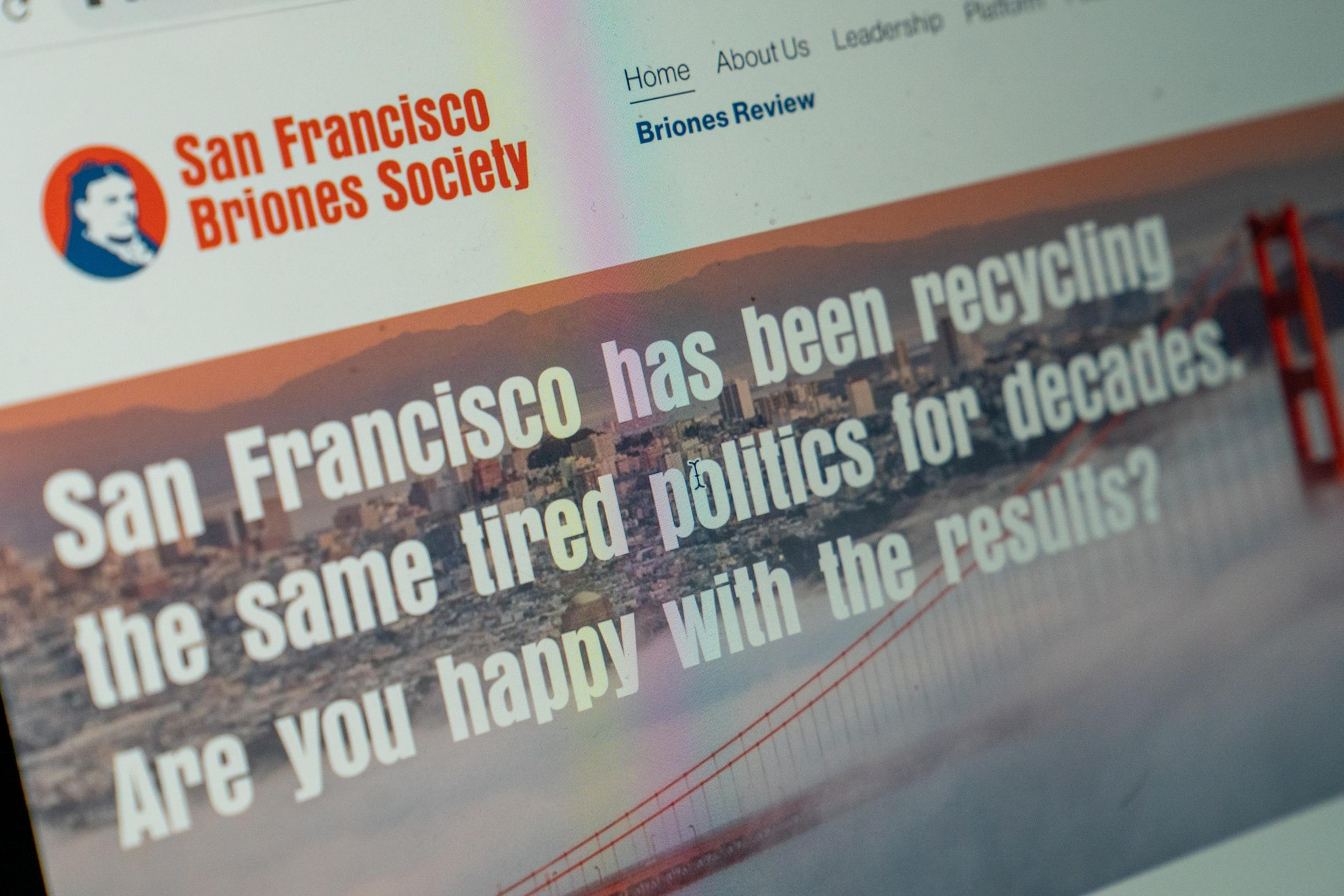 A laptop with the website for San Francisco Brones Society that reads &quot;San Francsico has been recycling the same tired politics for decades. Are. you happy with the Results?