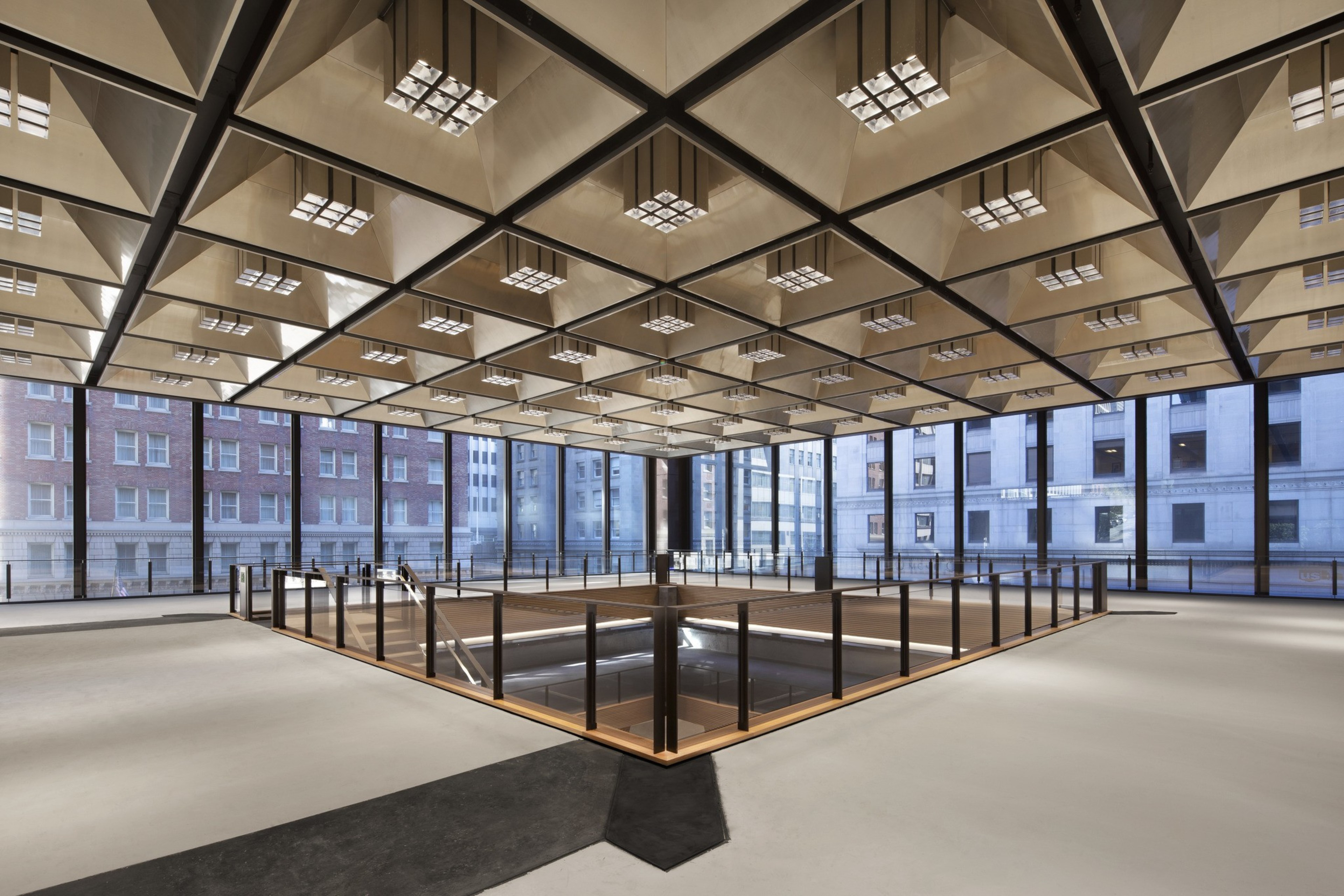 The top floor of an atrium is filled with natural light.