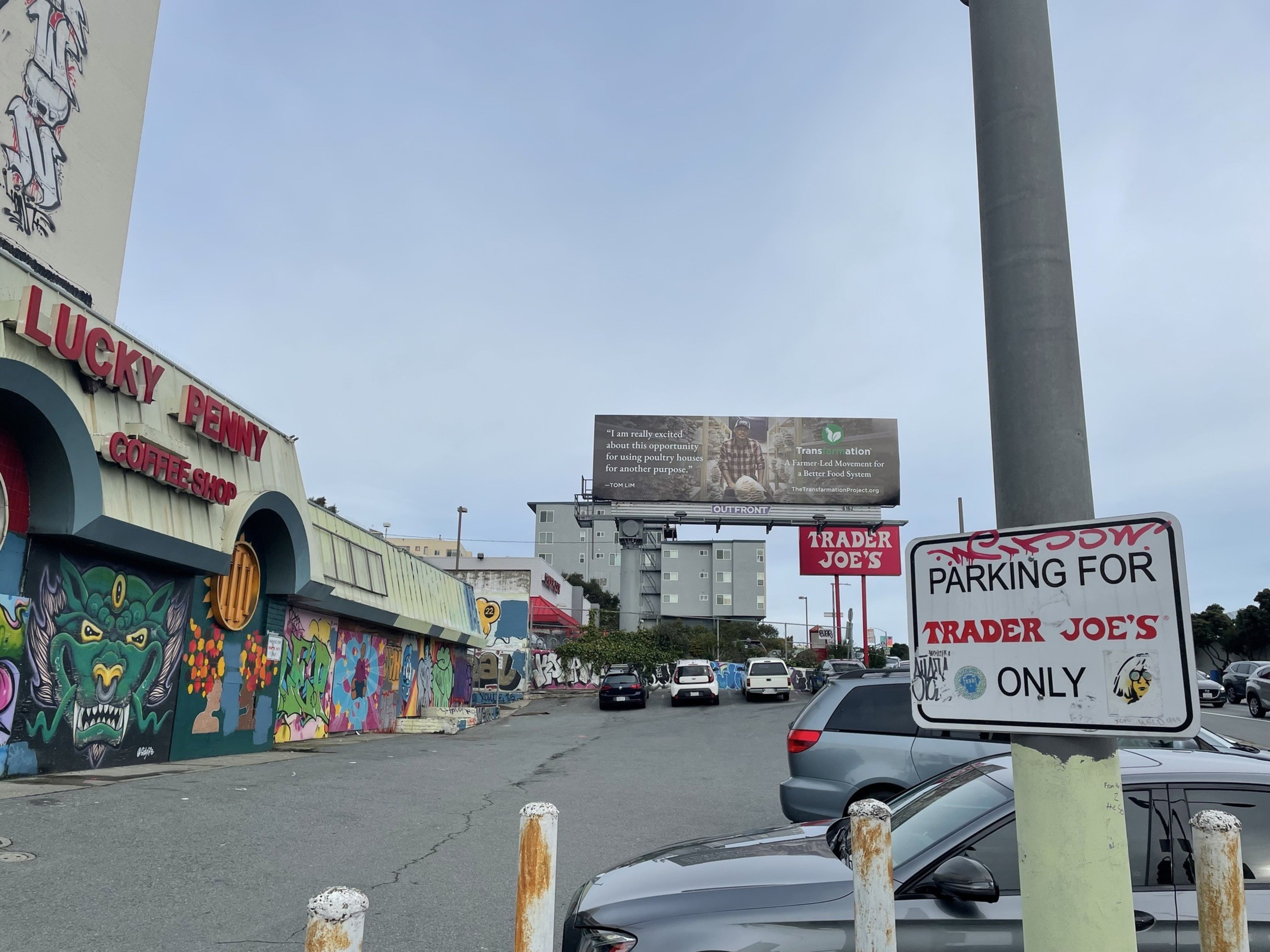 A parking lot sits in front of a shuttered diner.