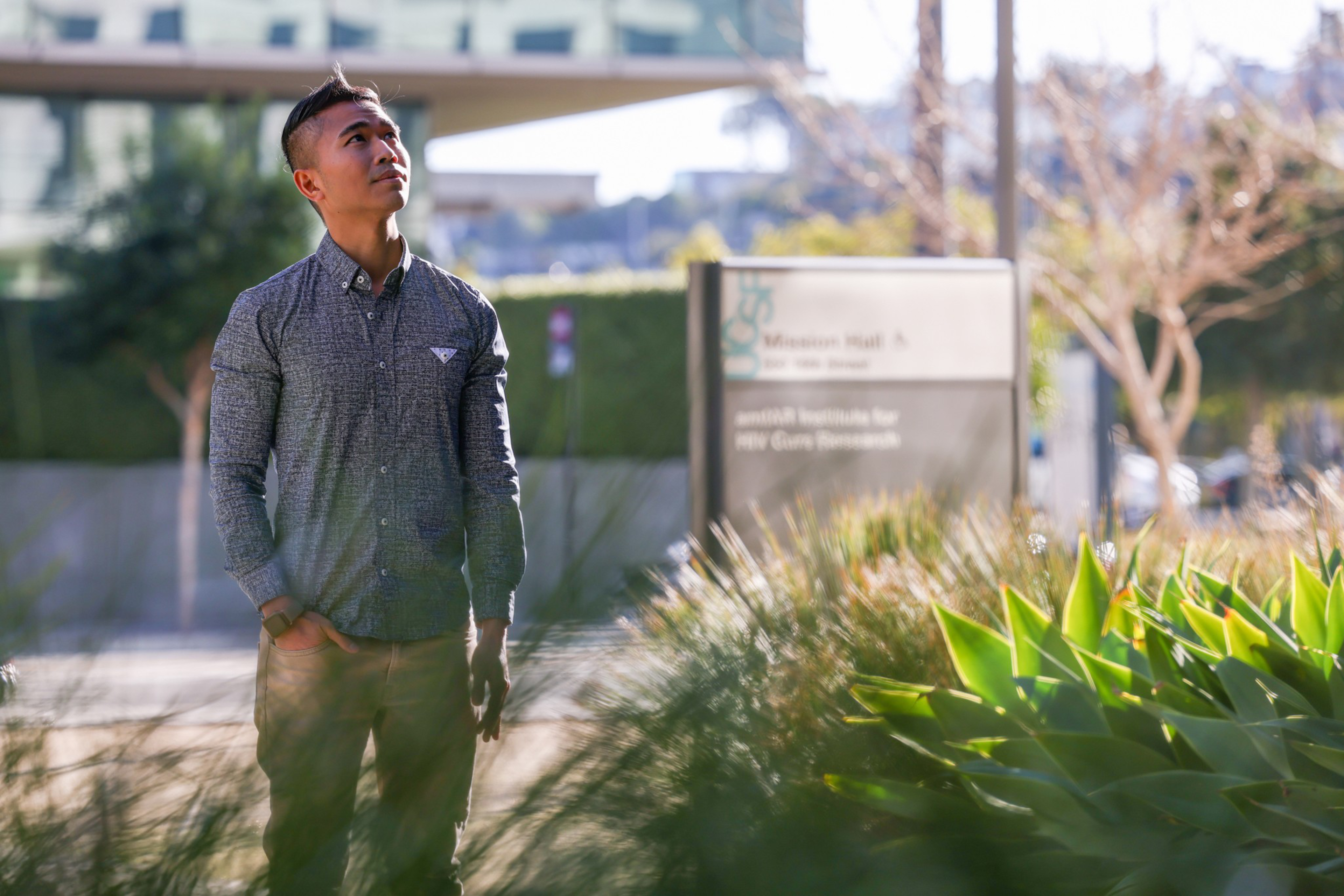 Dr. Glenn-Milo Santos poses for a portrait inside Mission Hall at UCSF Medical Center at Mission Bay on Tuesday, Jan. 31, 2023. Dr. Santos is a UCSF researcher studying new medications to combat alcoholism in the queer community. | Camille Cohen/The Standa