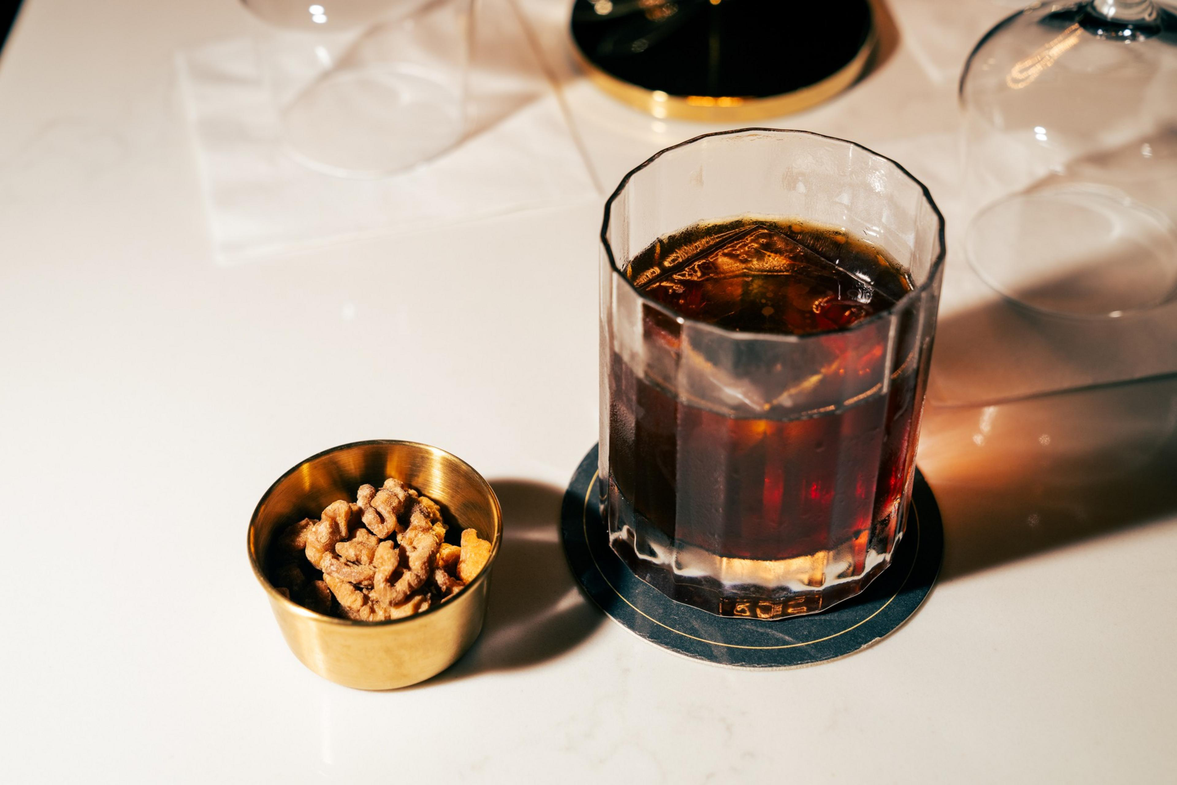 Patrons enjoying the Wally Rose can also snack on walnuts alongside the walnut-infused bourbon used in the cocktail.
