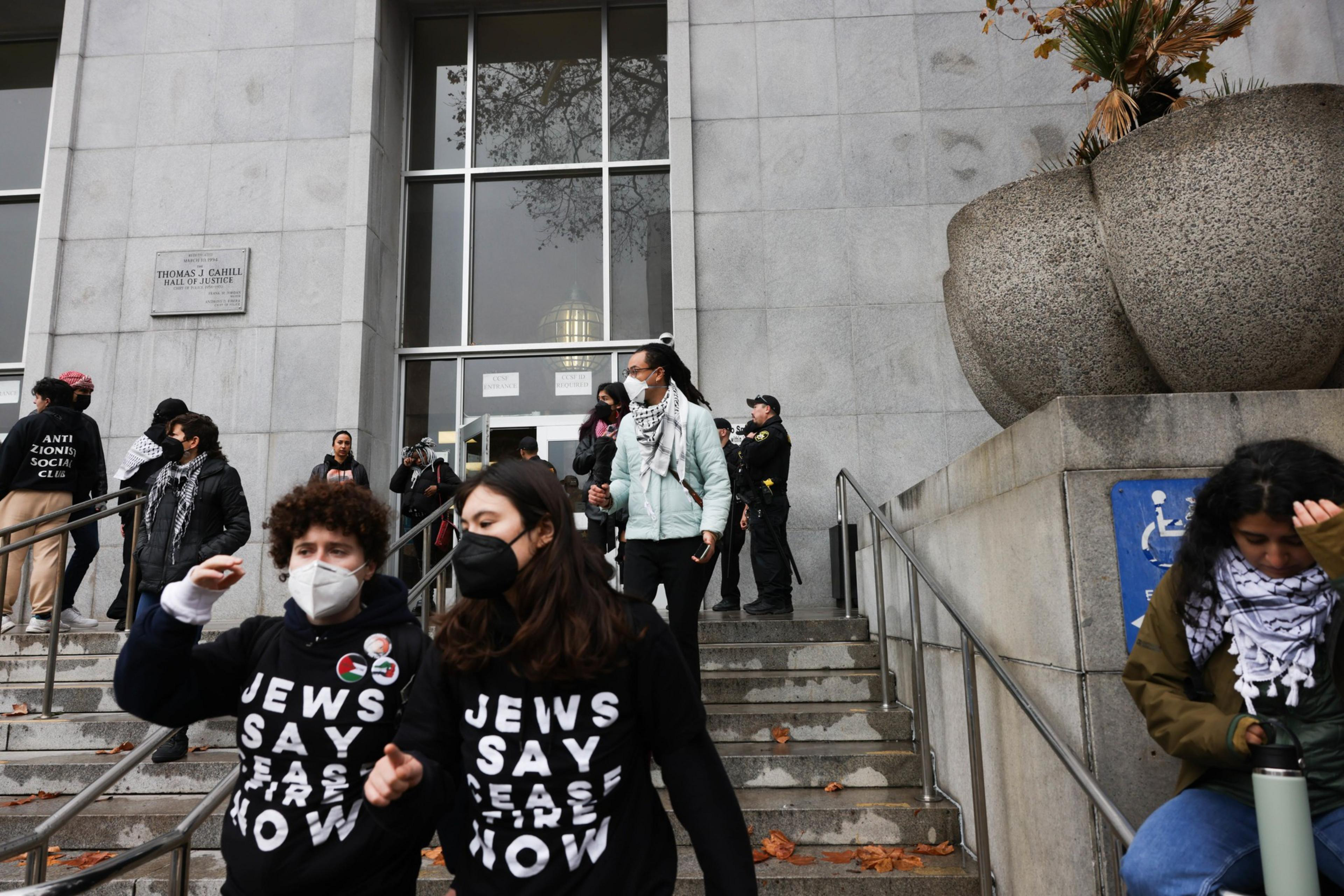 A group of protesters outside the Hall of Justice. 