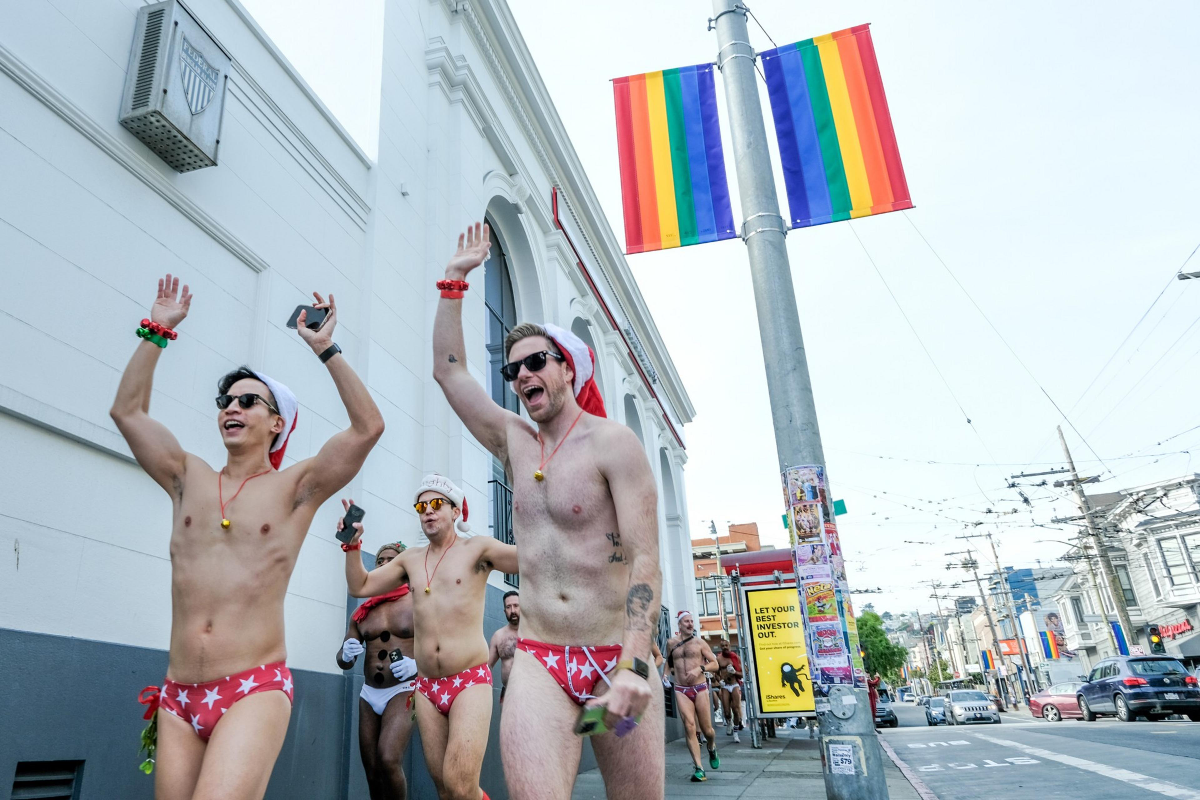 People dressed in underwear and Santa costumes rung across the street during a underwear fun run.