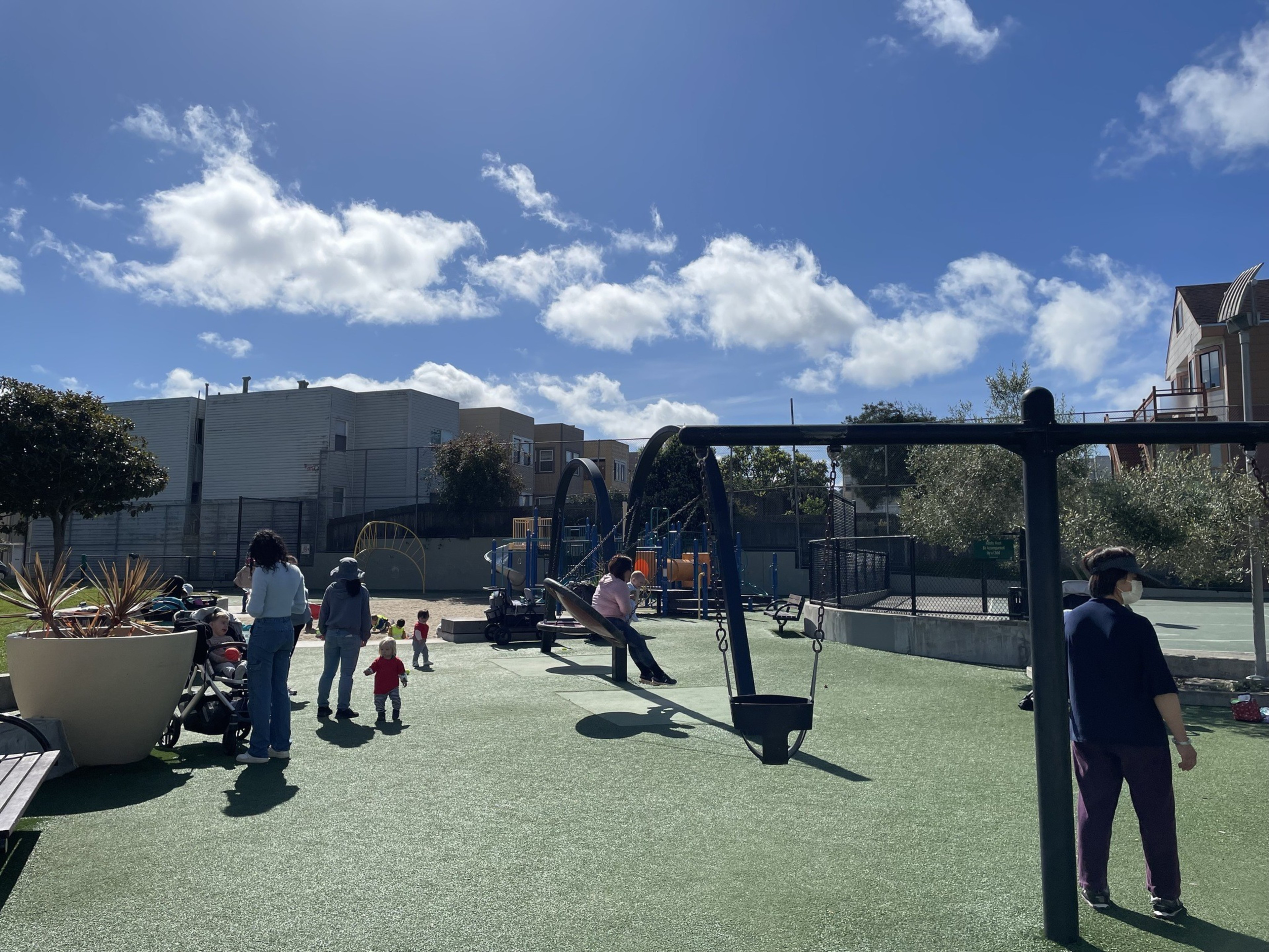 Kids play on a playground.