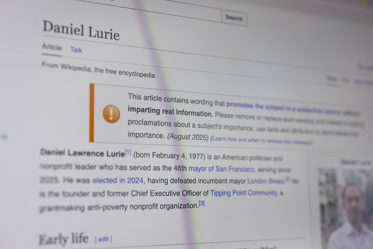 An article on Wikipedia about Daniel Lurie highlights a warning that it contains subjective wording affecting real information accuracy.