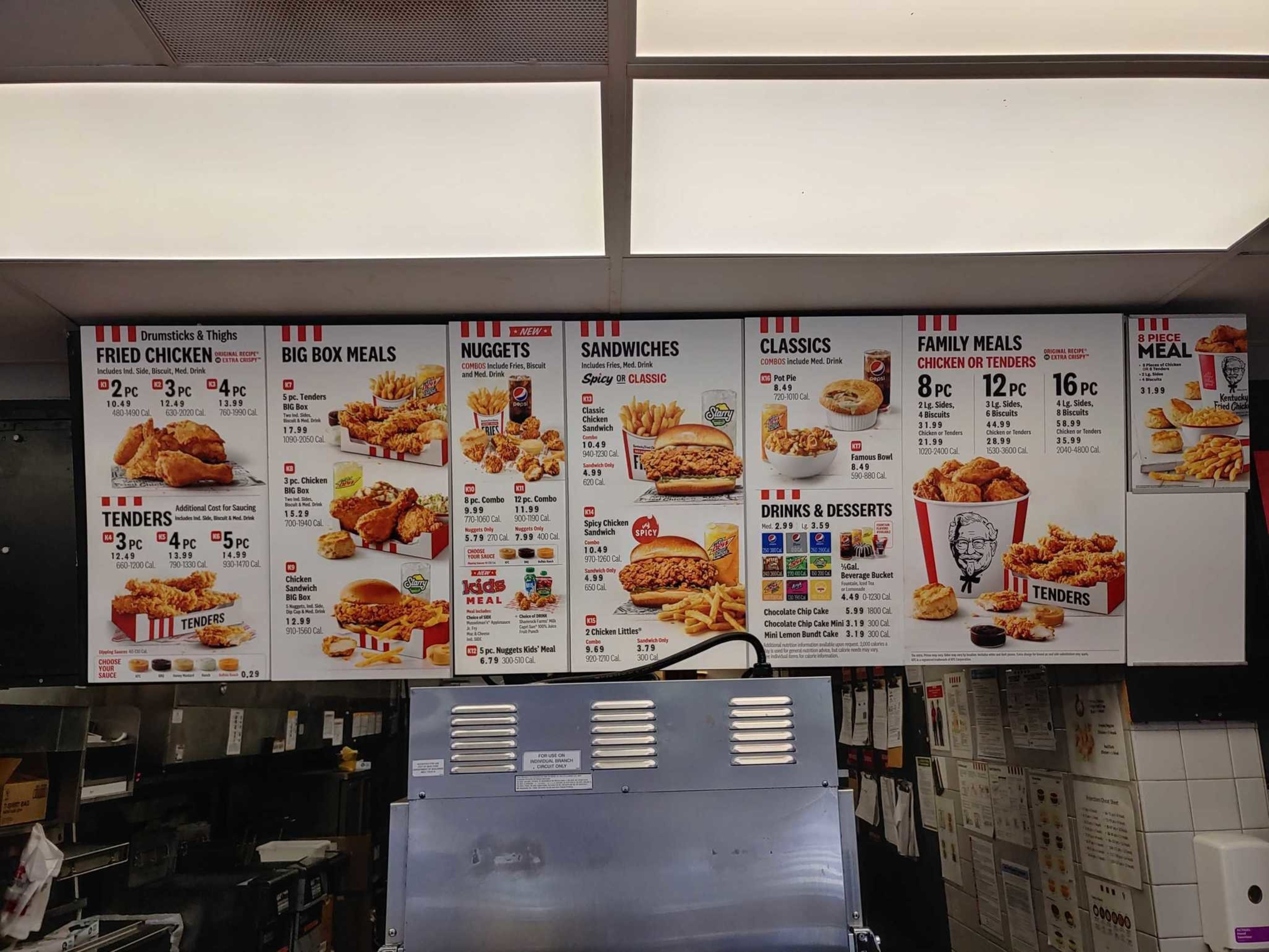 Fried chicken meals, tenders, big box meals, nuggets, sandwiches, family meals, classics like pot pie and Famous Bowl, plus drinks and desserts are listed on the menu.
