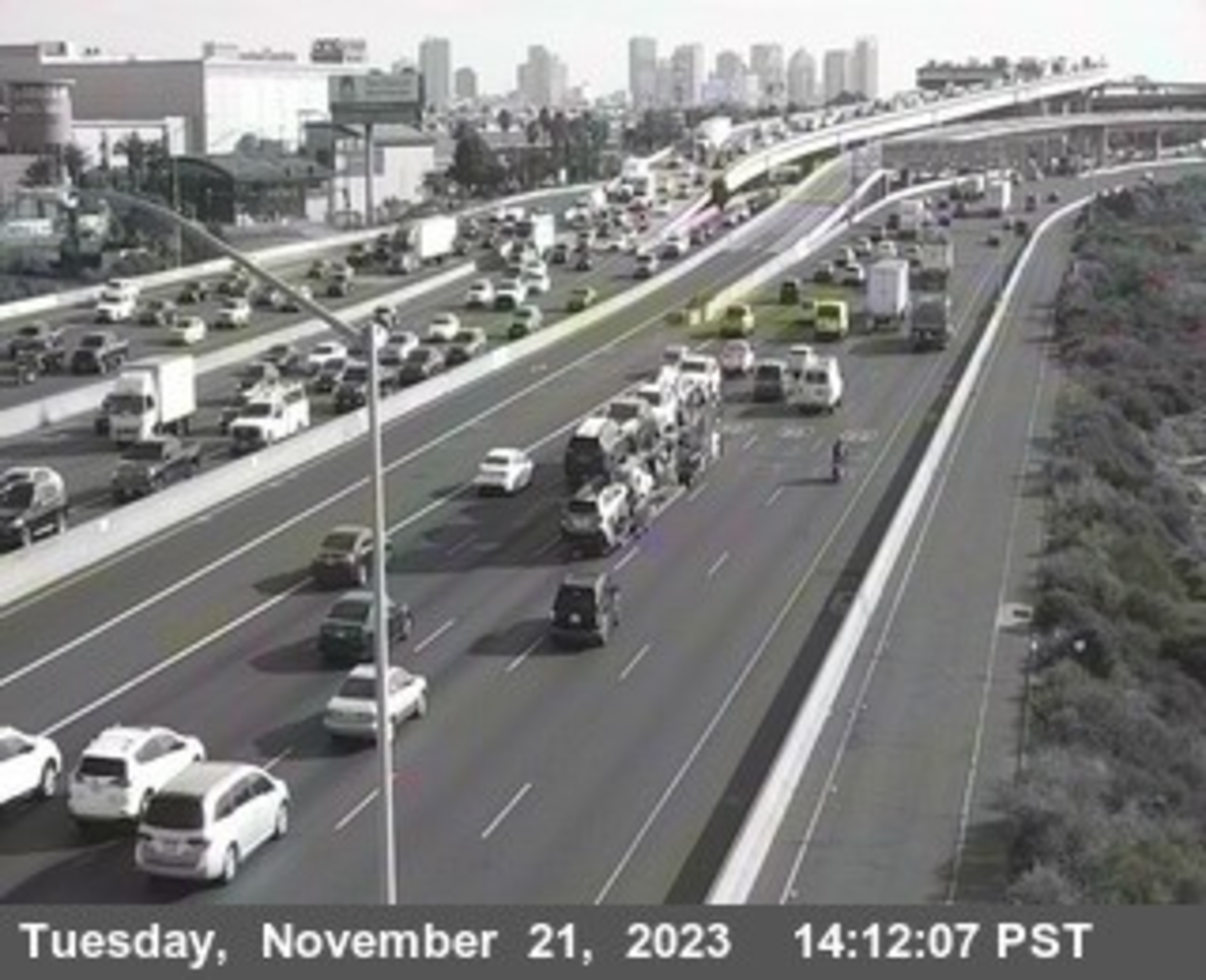 Heavy traffic streams on a highway.
