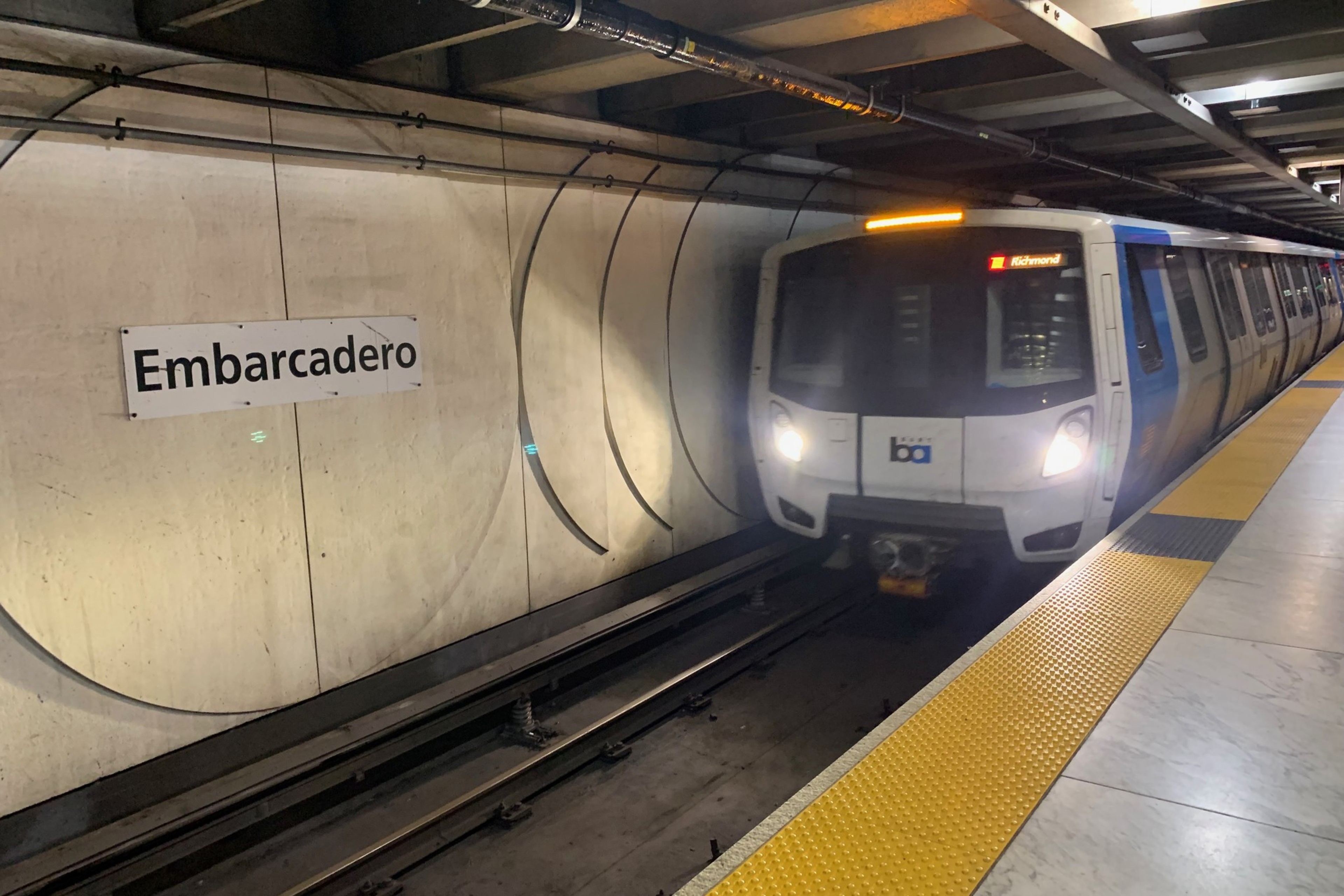 a bart train is seen at a station platform