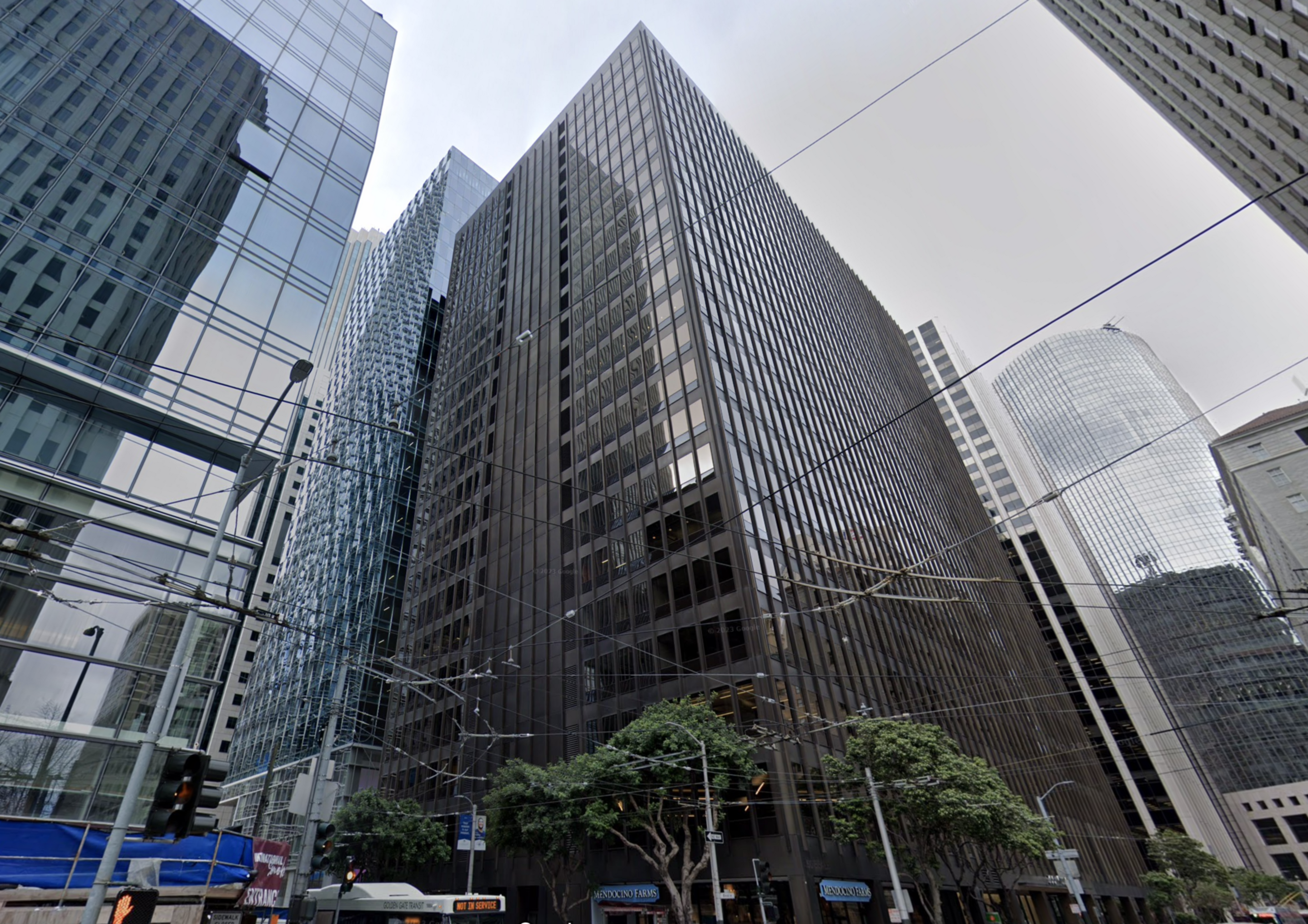 Big grey office building on a corner in san francisco