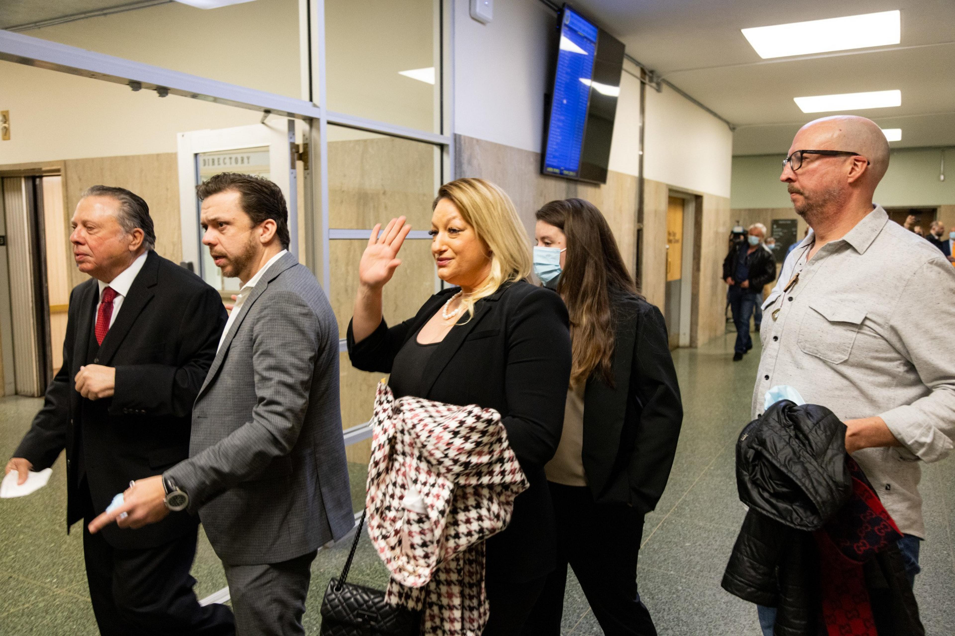 Five family members of Bob Lee walk out of court. 