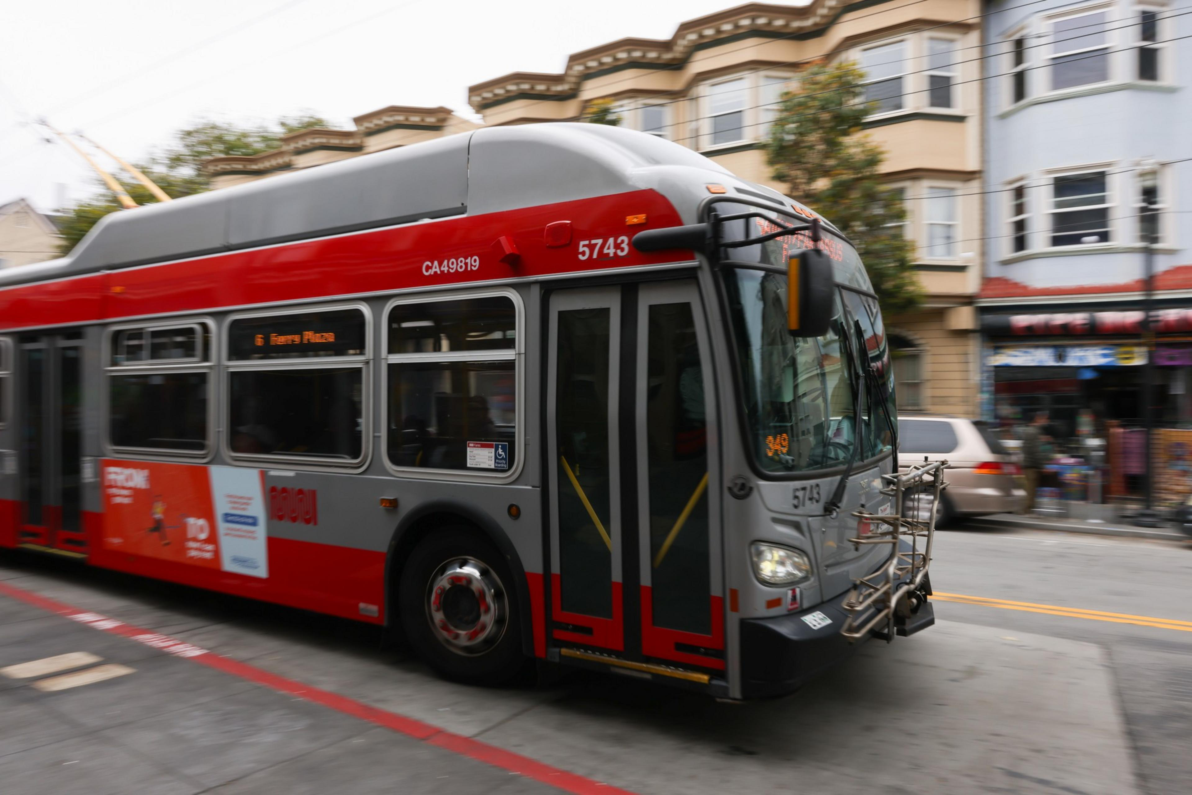 A red and gray bus