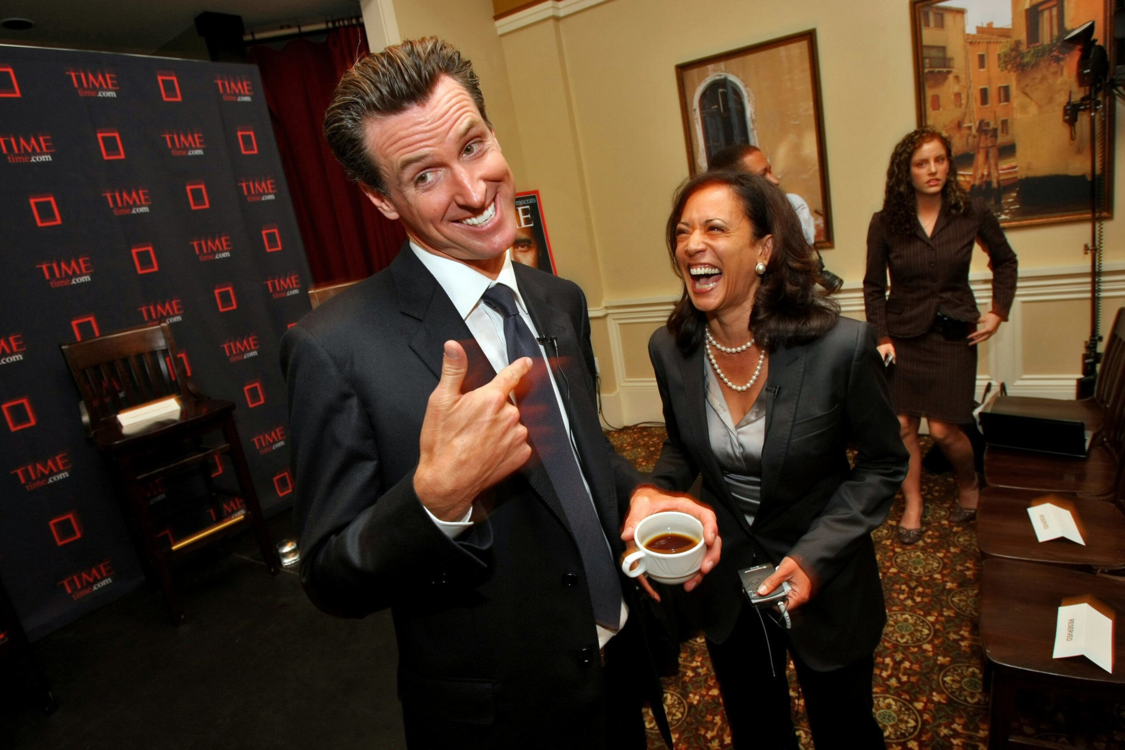 A man and a woman laugh.