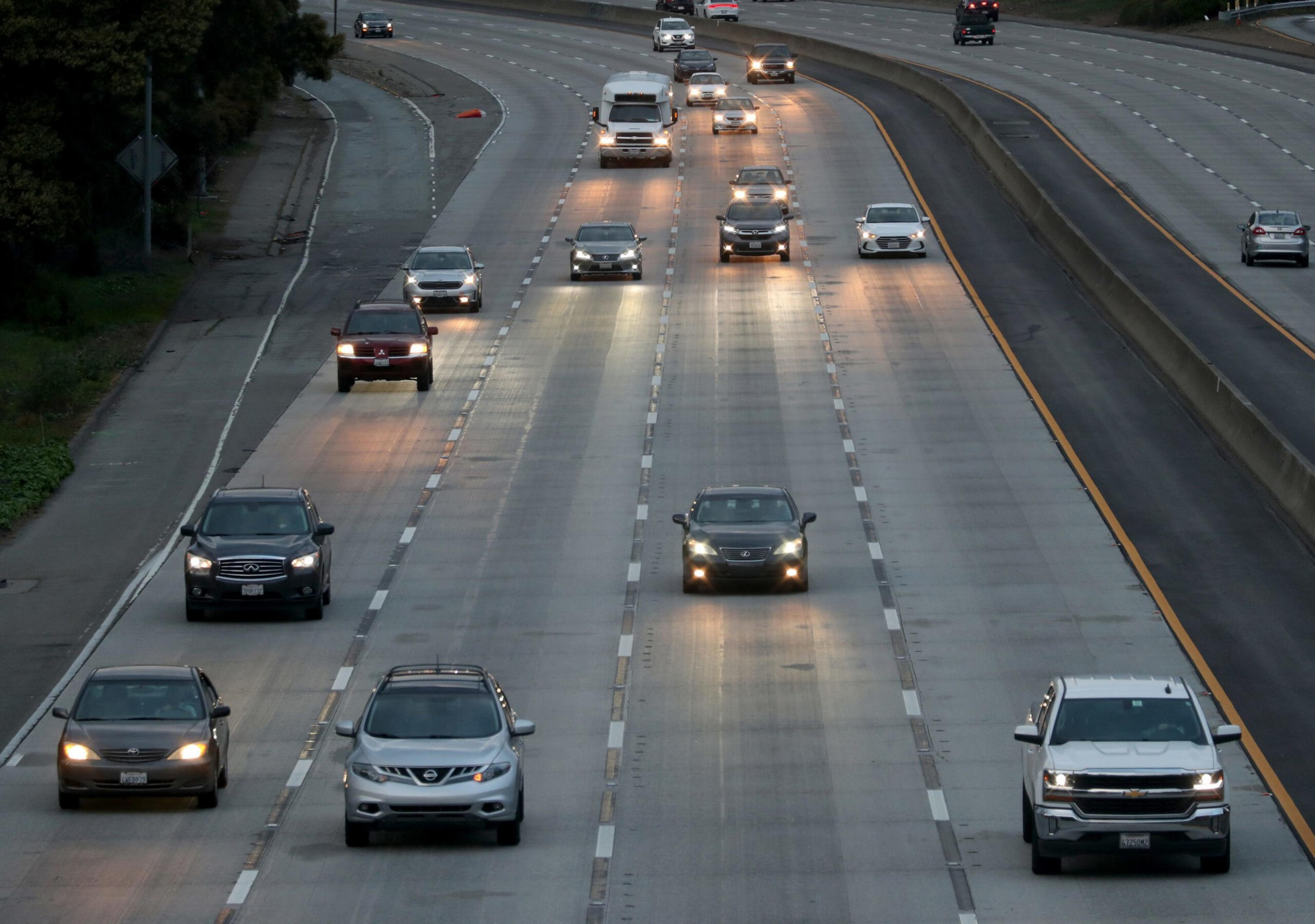 A multi lane highway with traffic moving at speed