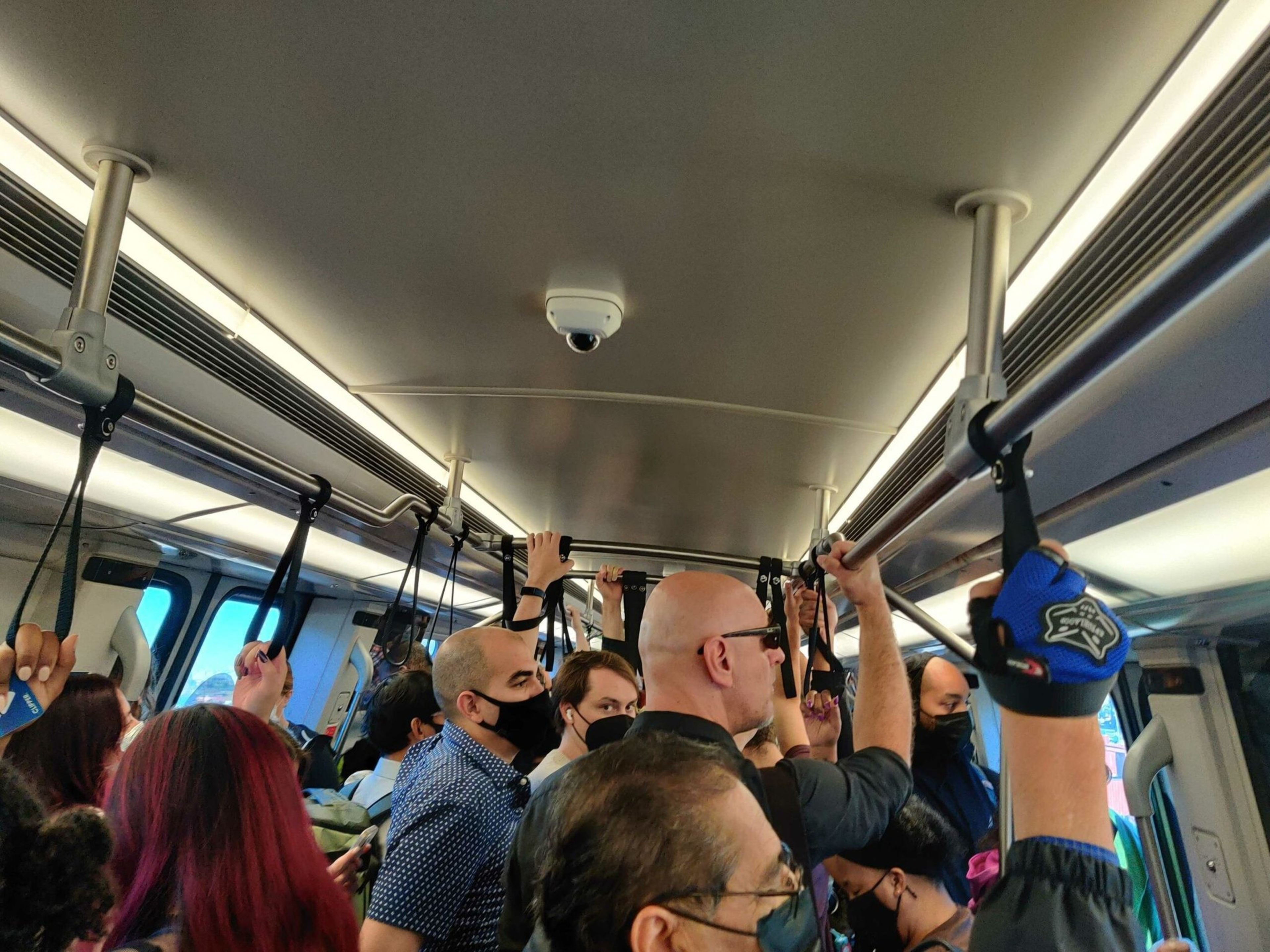A packed San Francisco-bound BART train sits idle before arriving at West Oakland Station. | Noah Baustin/The Standard