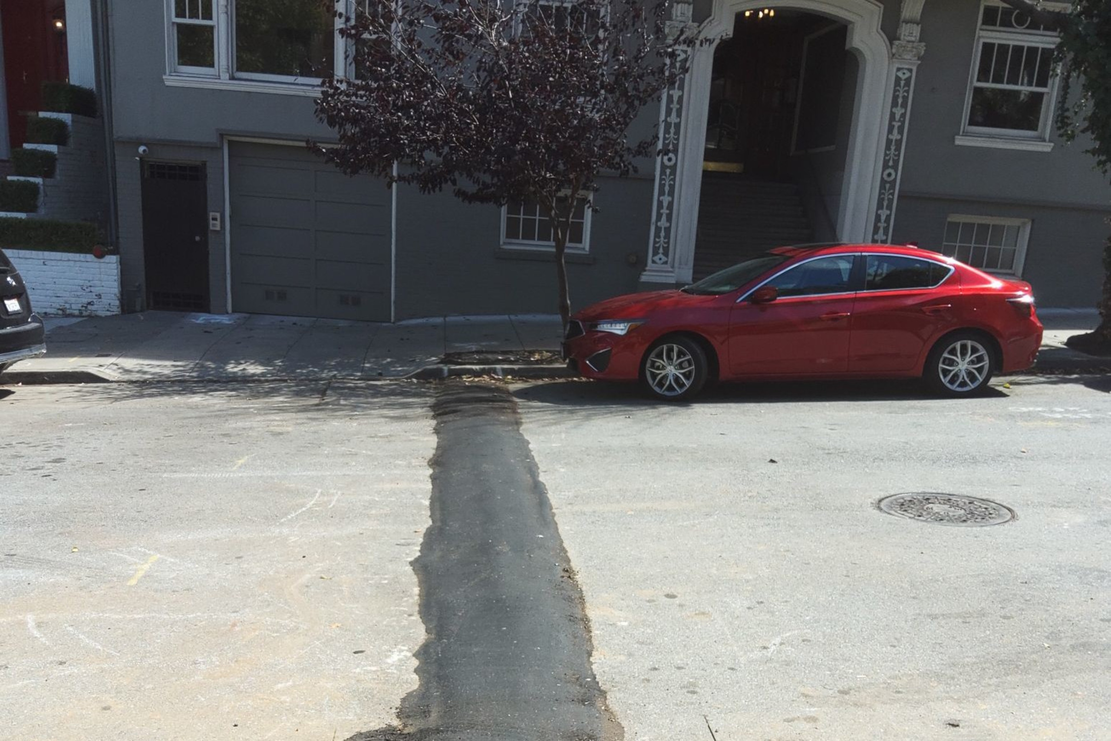 A road bump is seen on a street.
