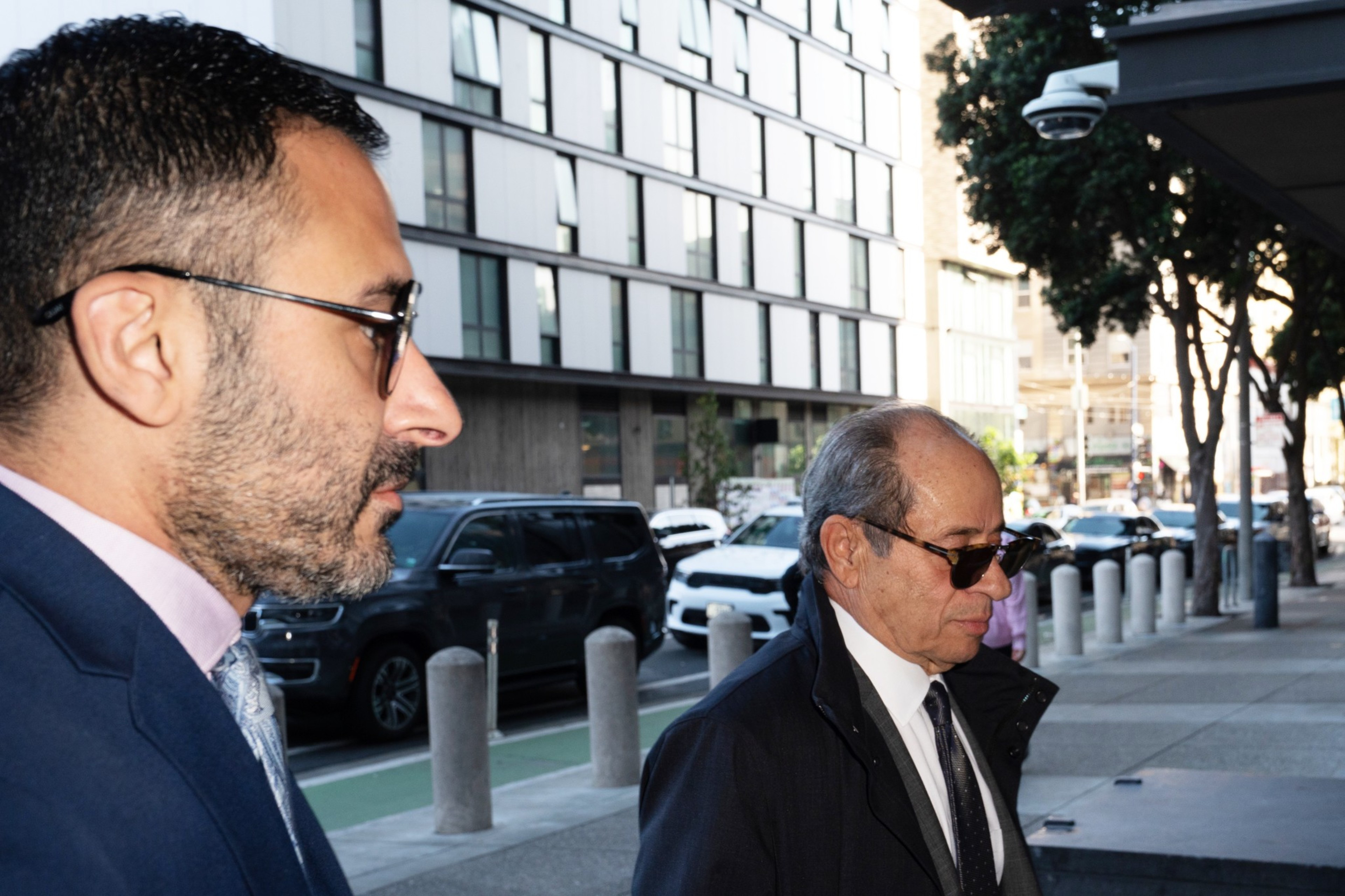 Two men walk into the federal building.